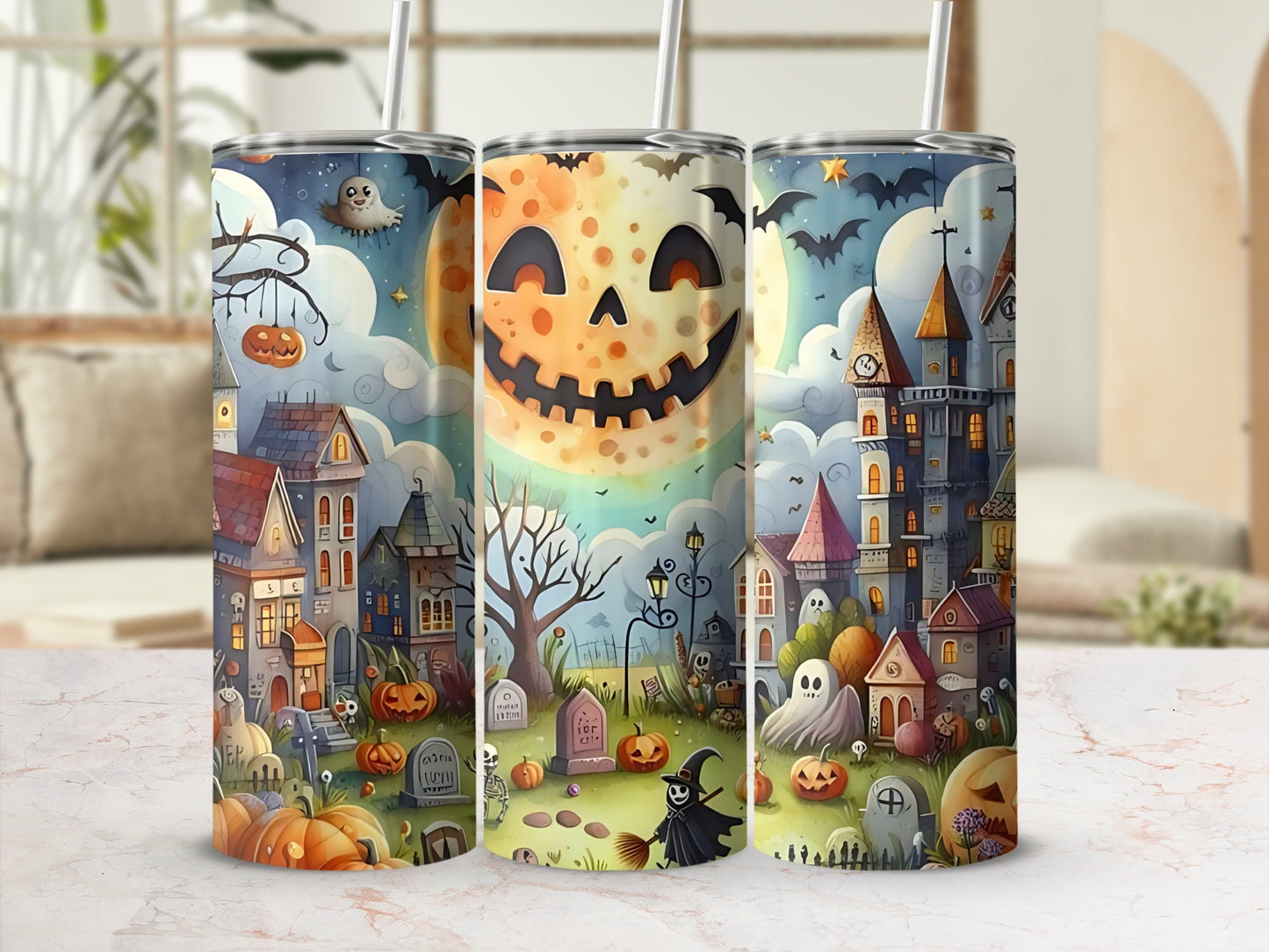 Three tumblers with a spooky Halloween village scene, featuring pumpkins, ghosts, and haunted houses.