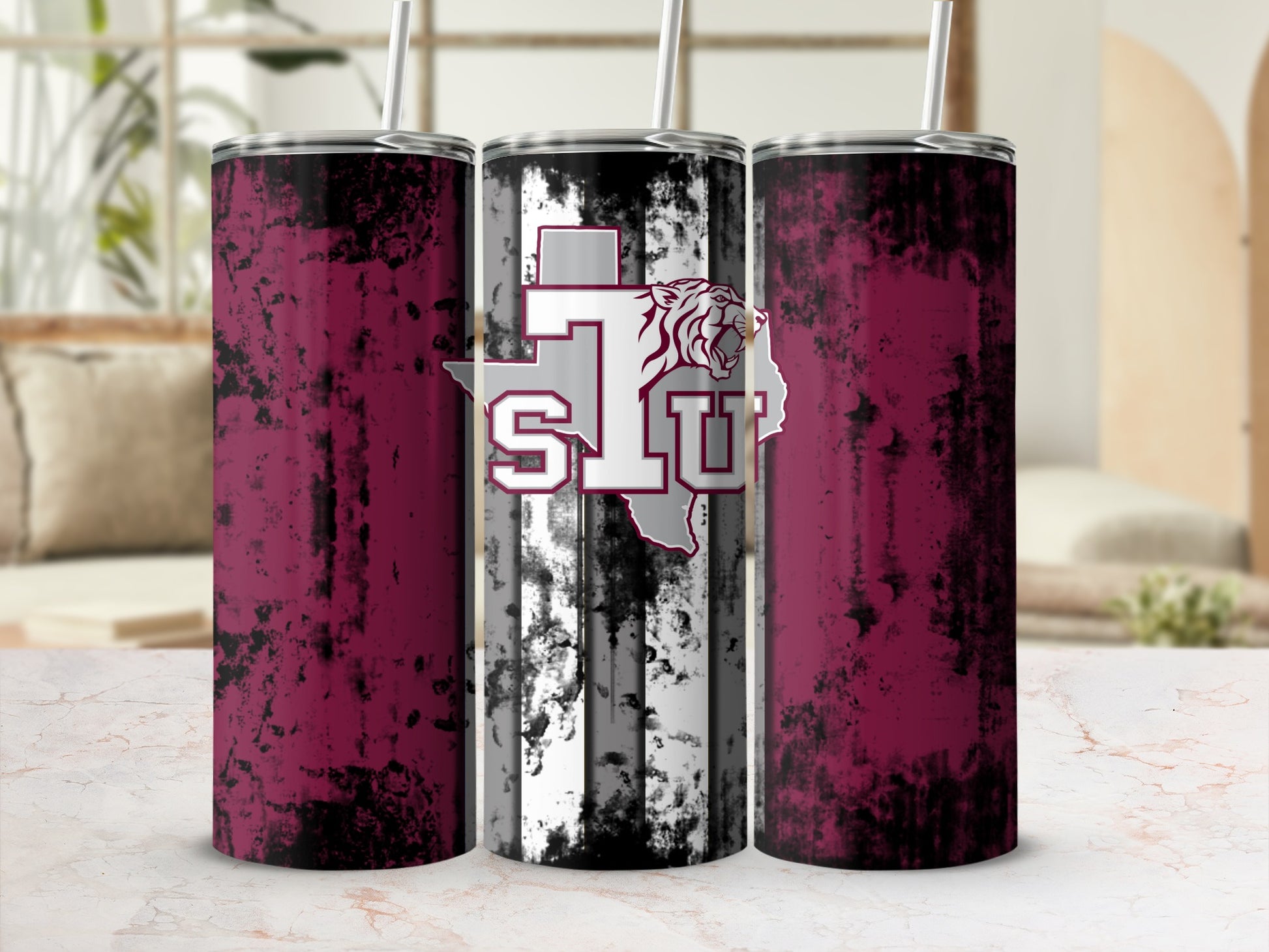 Tumblers with distressed maroon design and a tiger head logo with "STU" text.