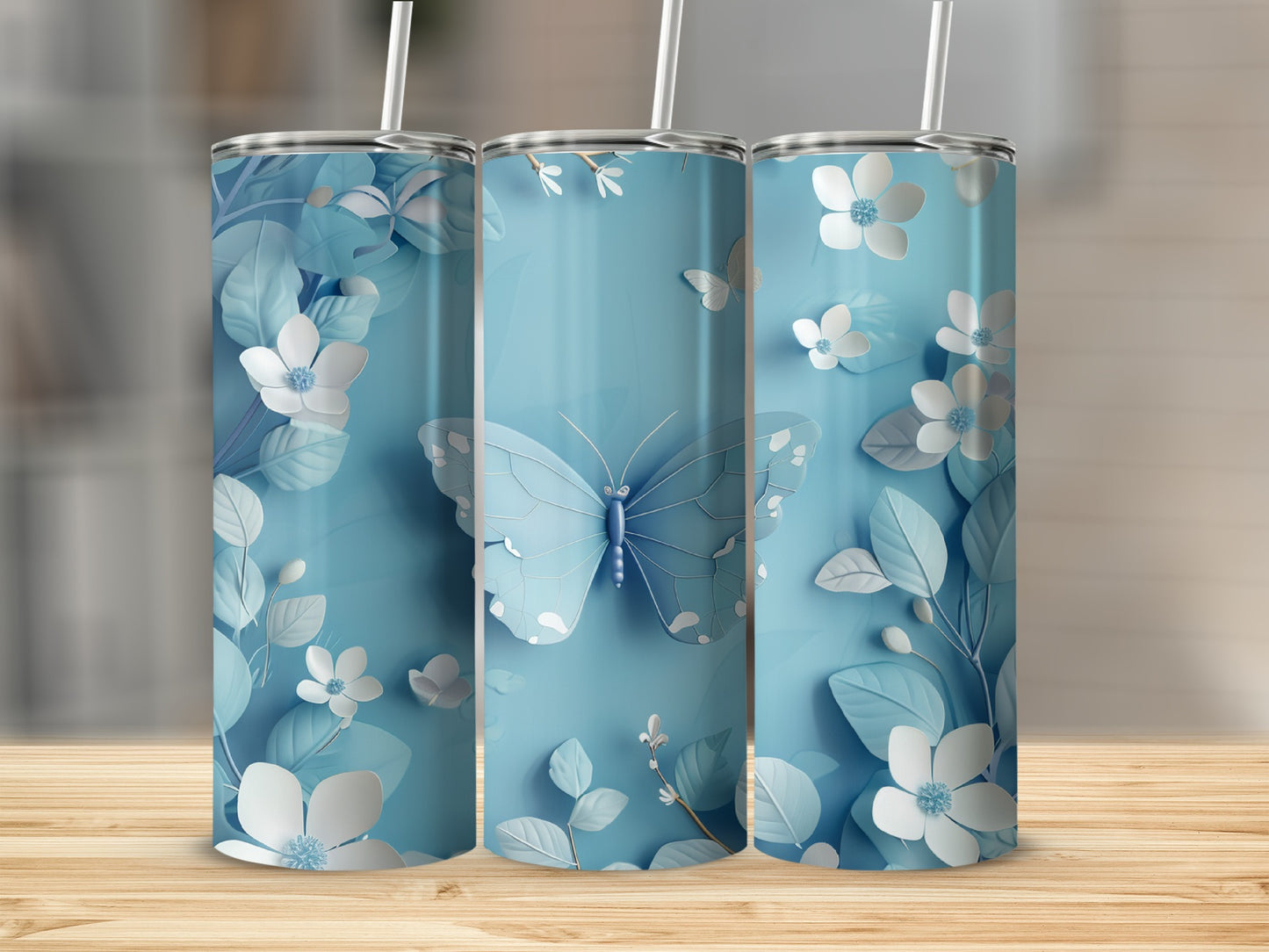 Light blue tumbler with butterflies and white flowers design.