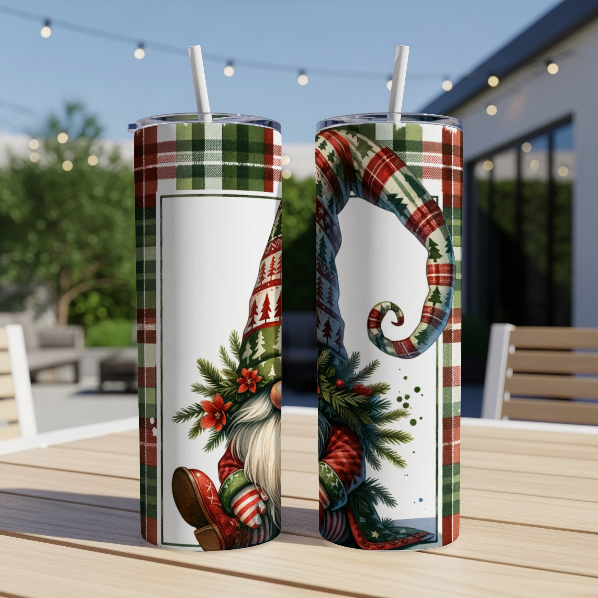 Two Christmas gnomes with patterned hats and red shoes on a table.