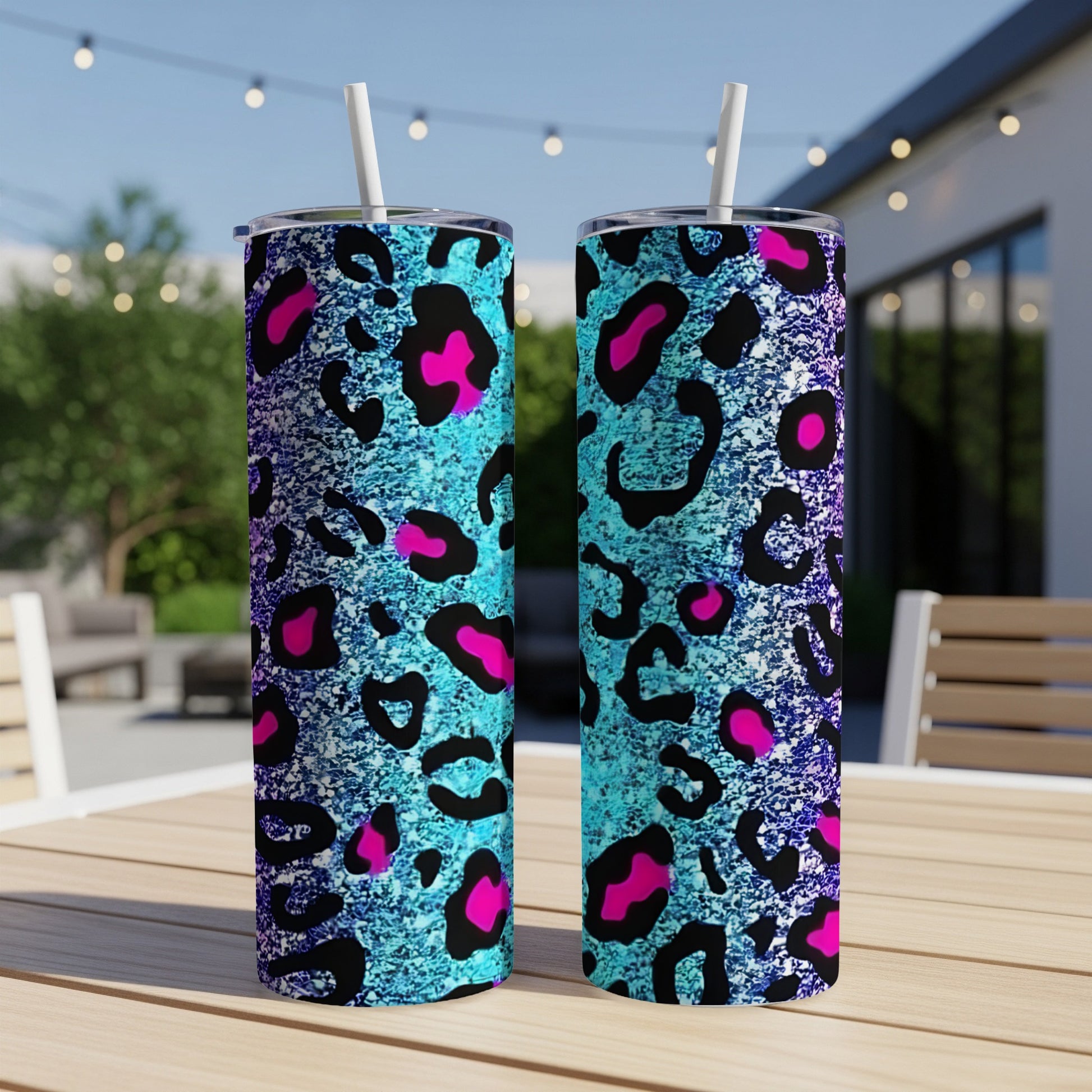 Two tall tumblers with teal, pink, and black leopard print design.