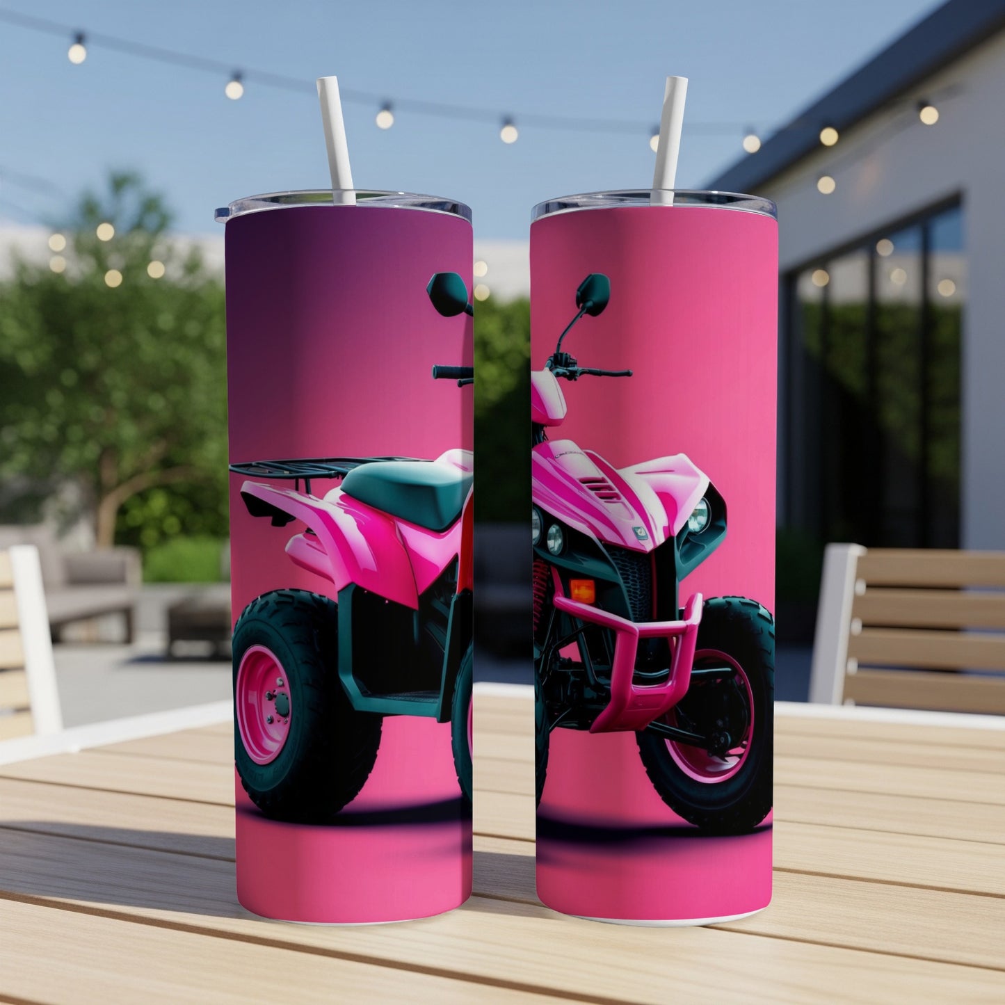 Pink ATV tumbler with straw on a wooden table.