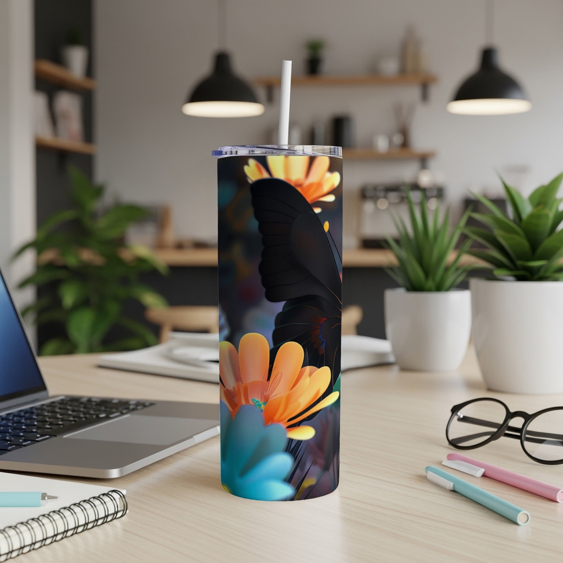 Black butterfly and orange flowers on a white tumbler with a straw.
