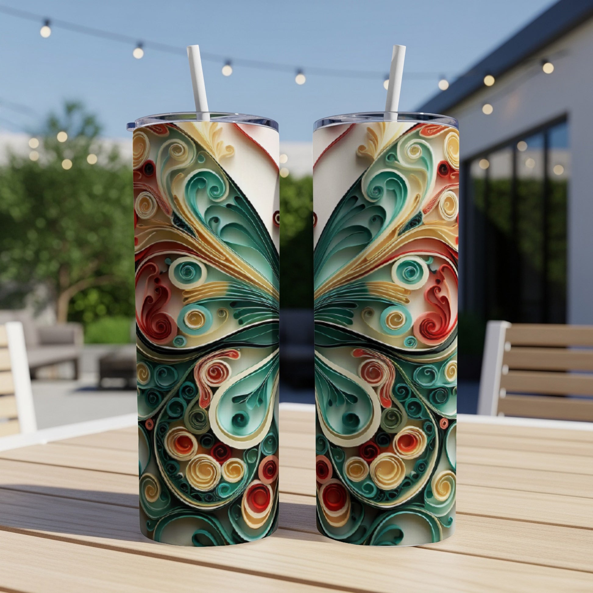 Two tall, slender tumblers with a colorful, intricate butterfly wing design.