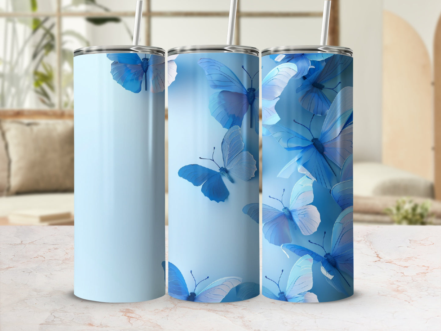 Light blue tumbler with blue butterflies, set against a blurred background.