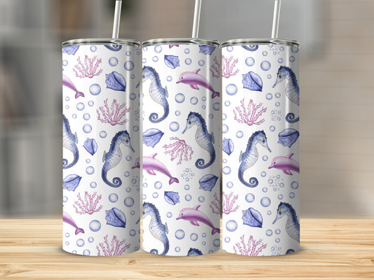 Three tumblers with a repeating pattern of seahorses, dolphins, shells, and bubbles.