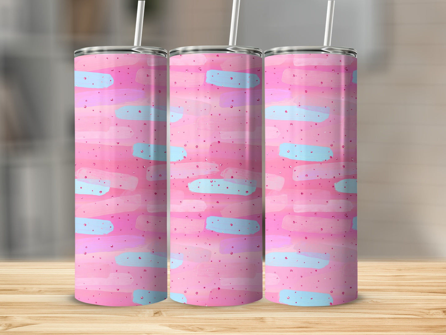 Pink tumbler with pastel blue and pink brushstroke pattern.