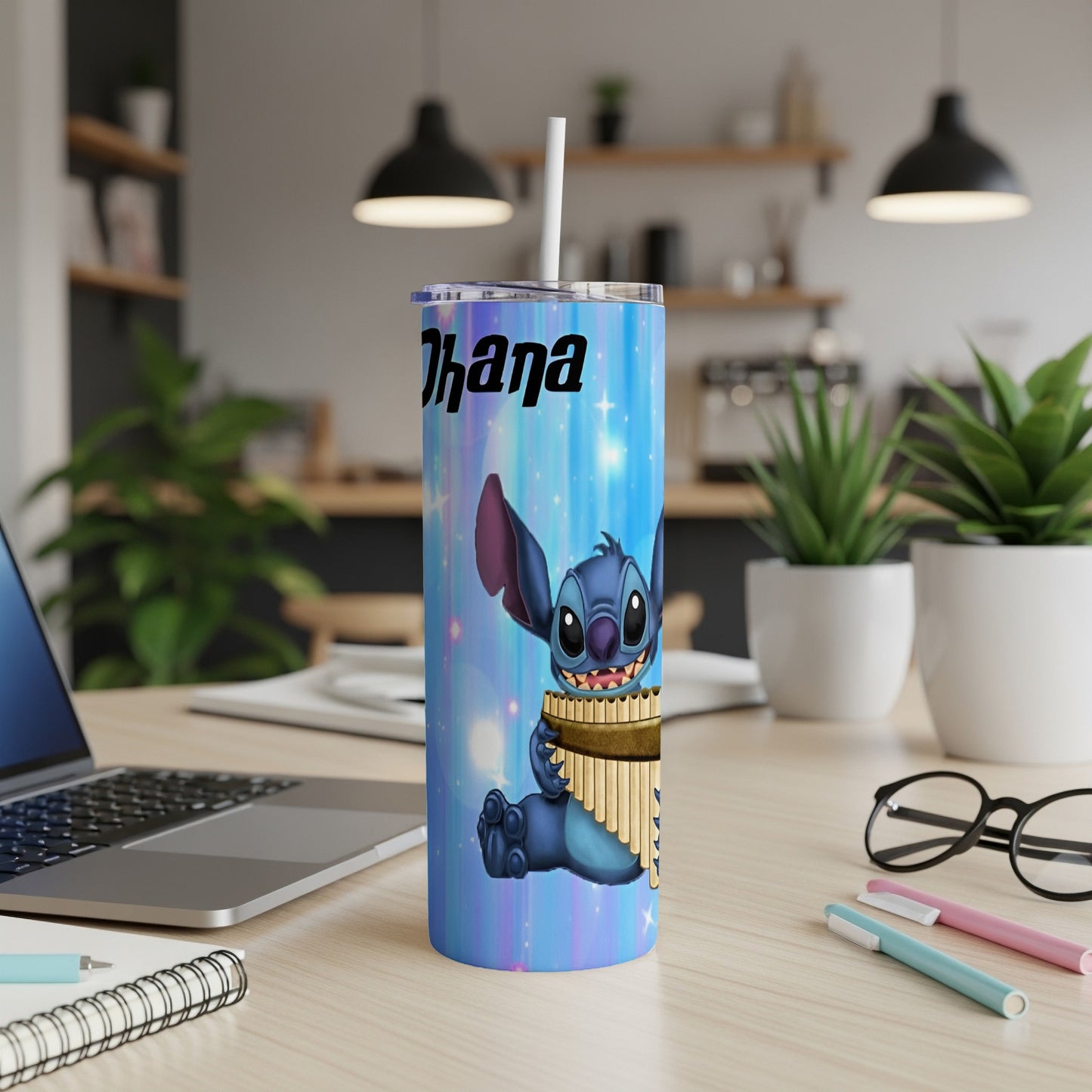 Stitch holding panpipes on a blue, starry tumbler with "Ohana" text.