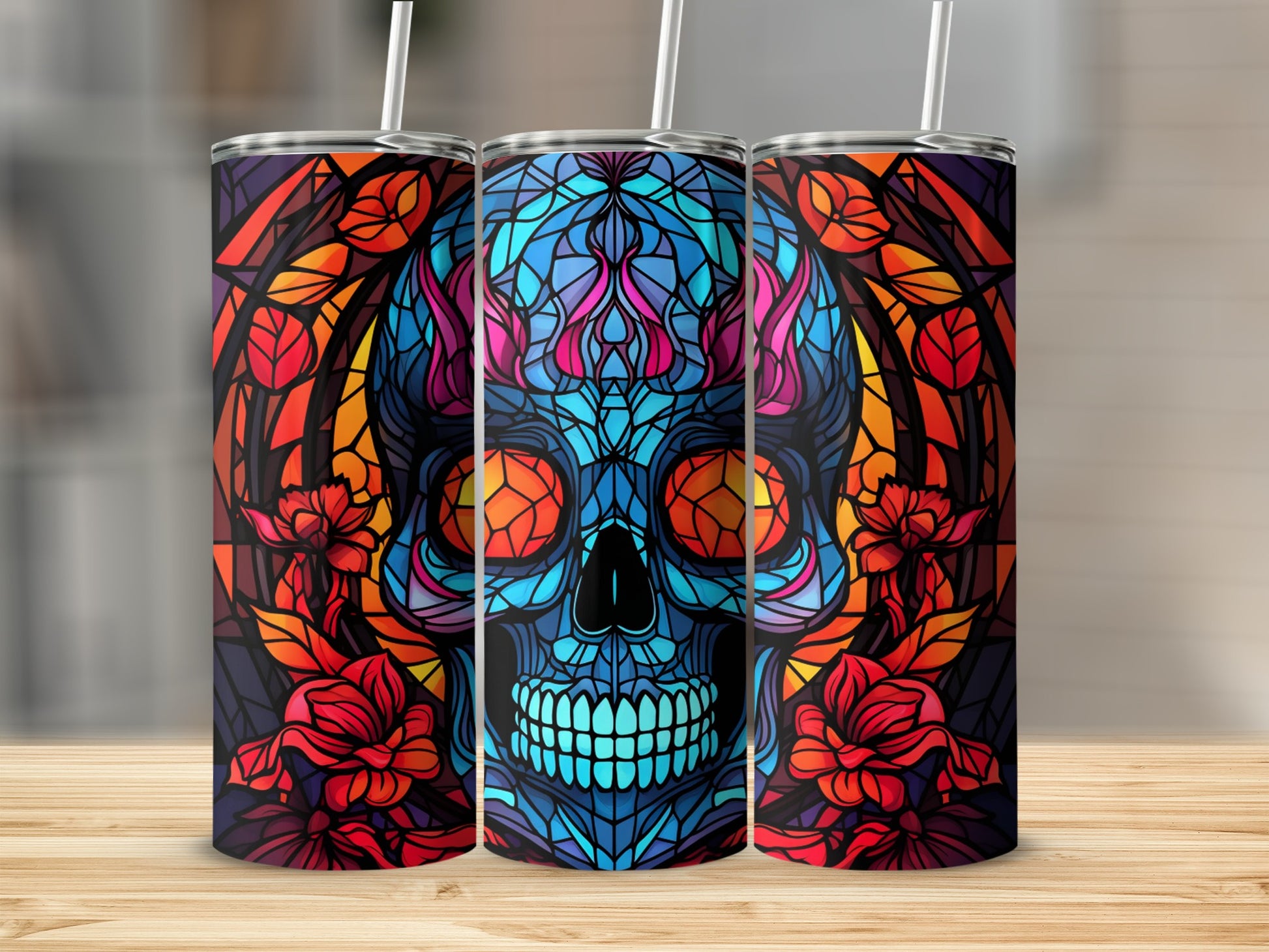 Stained glass skull with floral accents on a patterned tumbler.