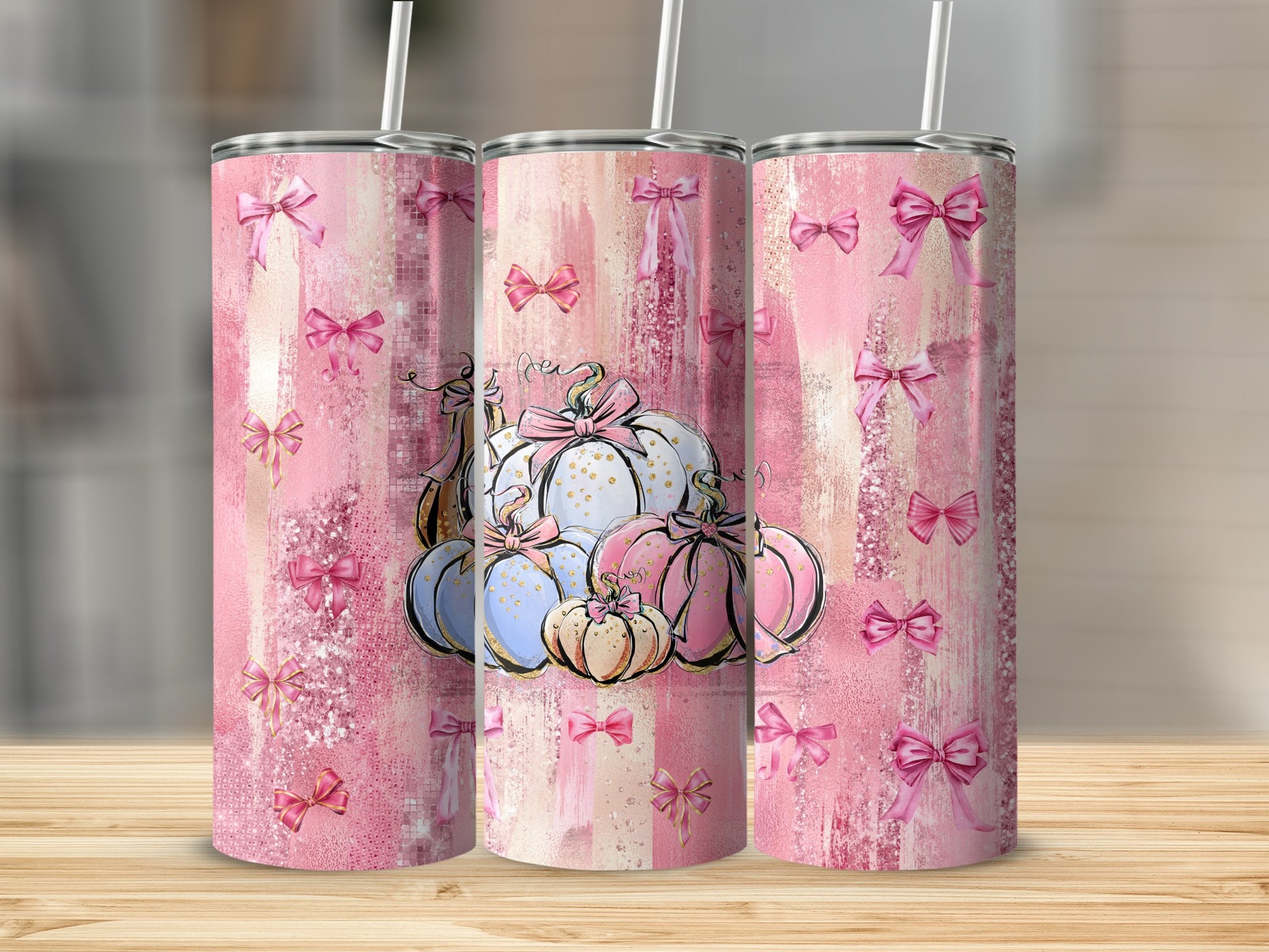 Pink watercolor pumpkin tumbler with scattered bows and straw.
