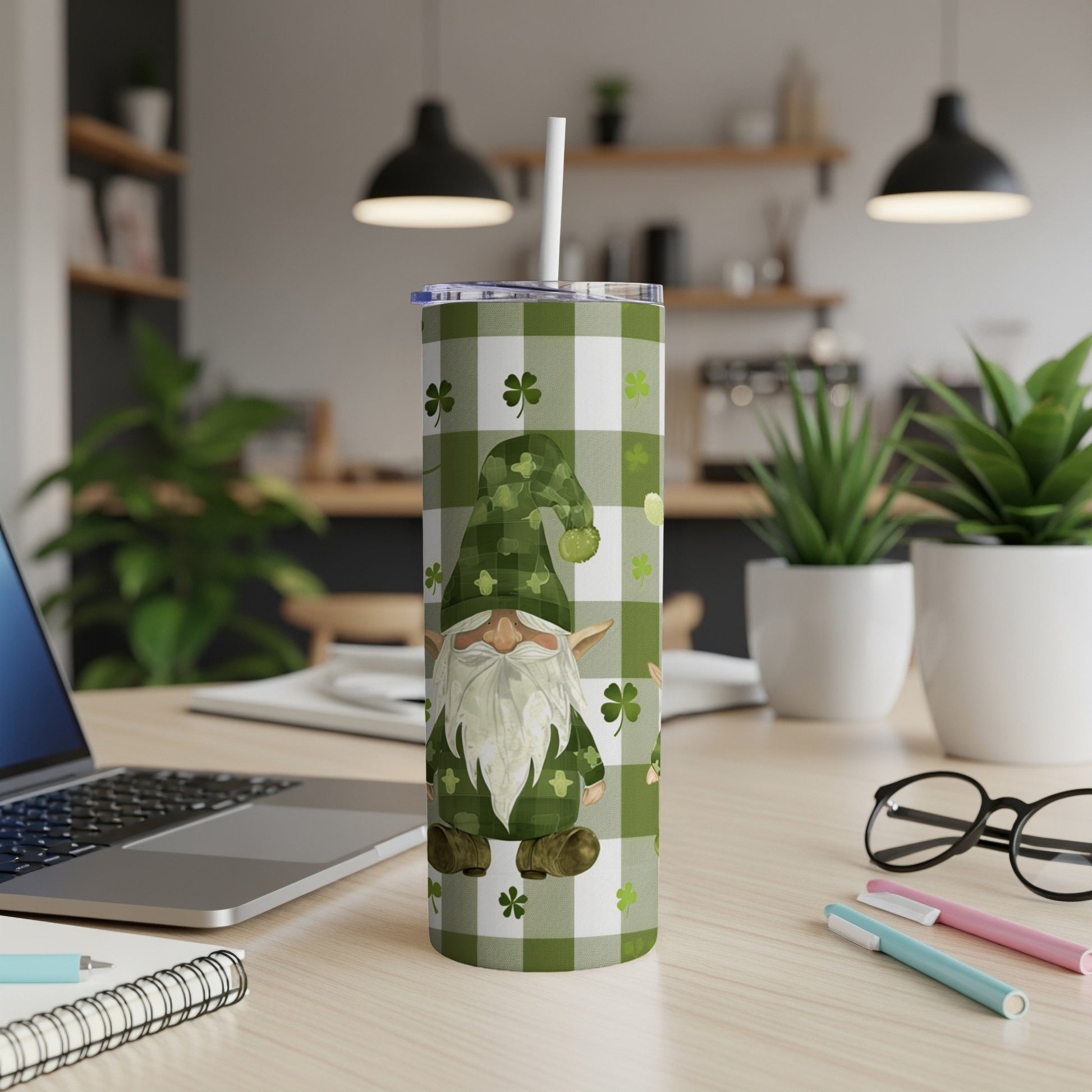 Green plaid tumbler with a gnome and shamrocks, a straw protruding.