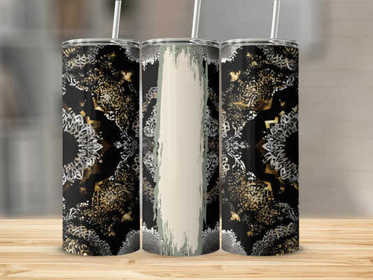 Three tumblers with black, gold, and white mandala pattern and straw.