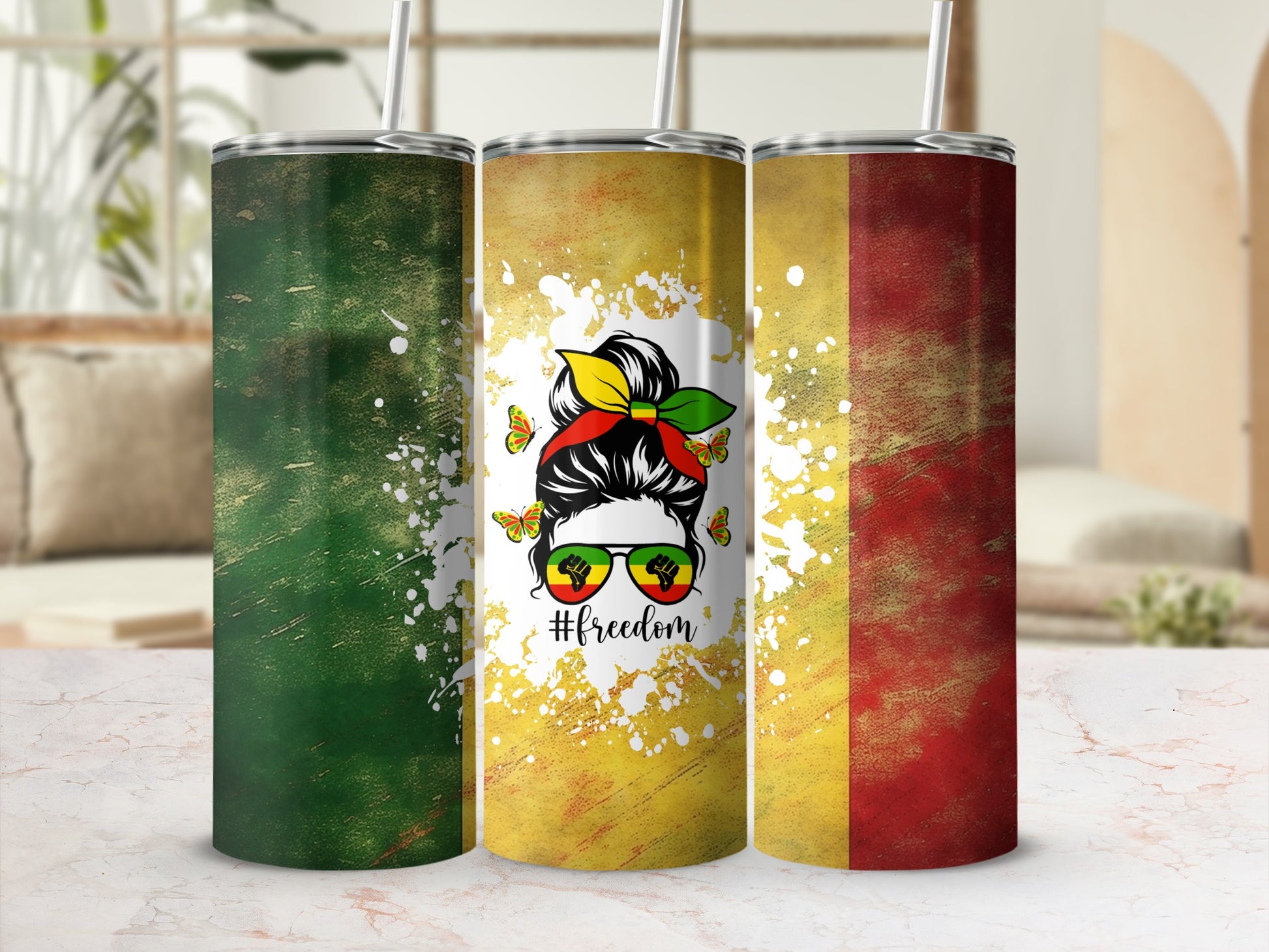 Three tumblers with a woman's silhouette, sunglasses, and #freedom.