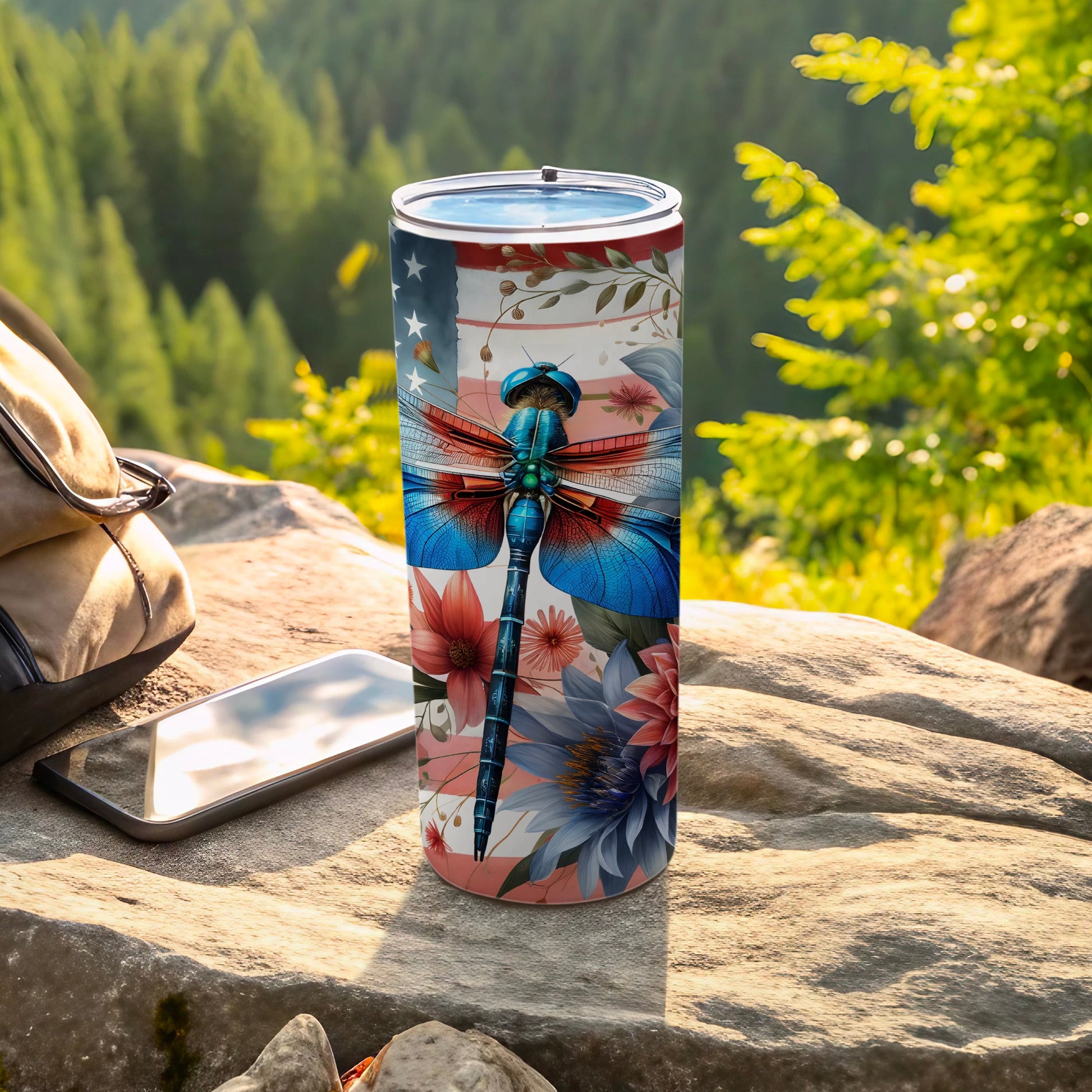 Tumbler with patriotic dragonfly and floral design.