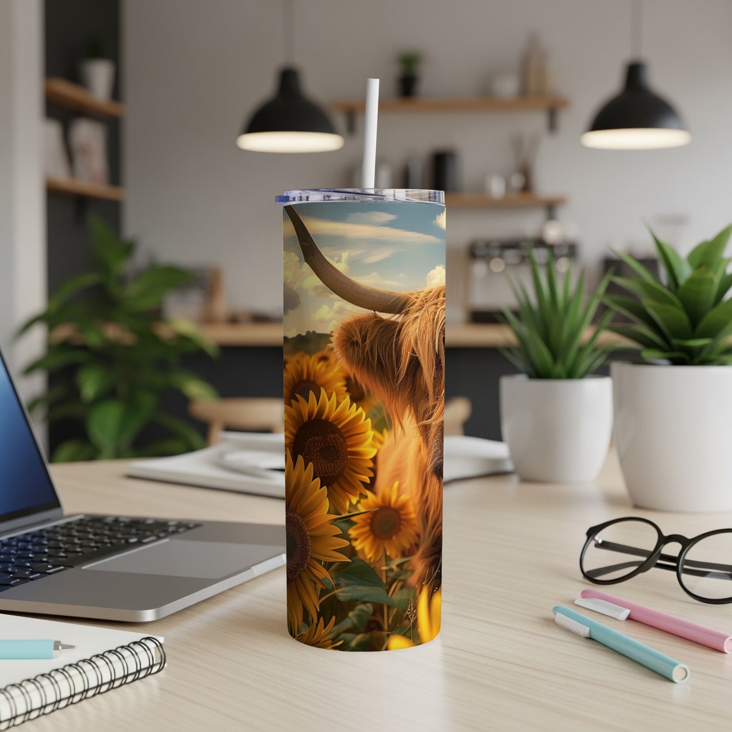 Highland cow and sunflowers on a tumbler with a straw.