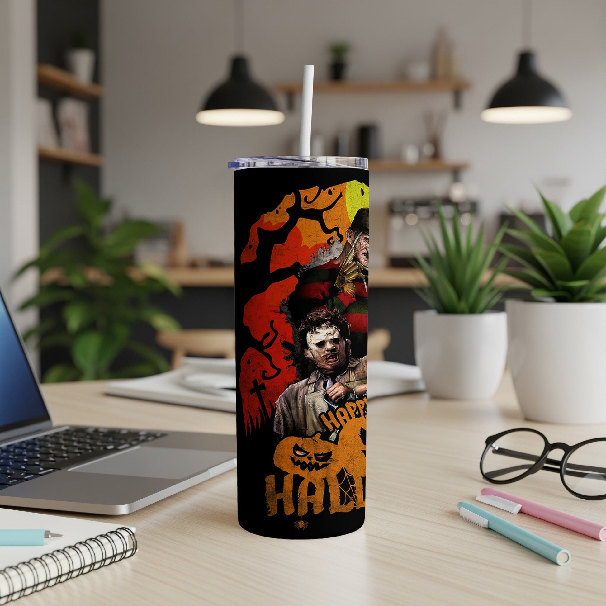 Tumbler with horror villains Freddy Krueger and Leatherface, and Halloween graphics.