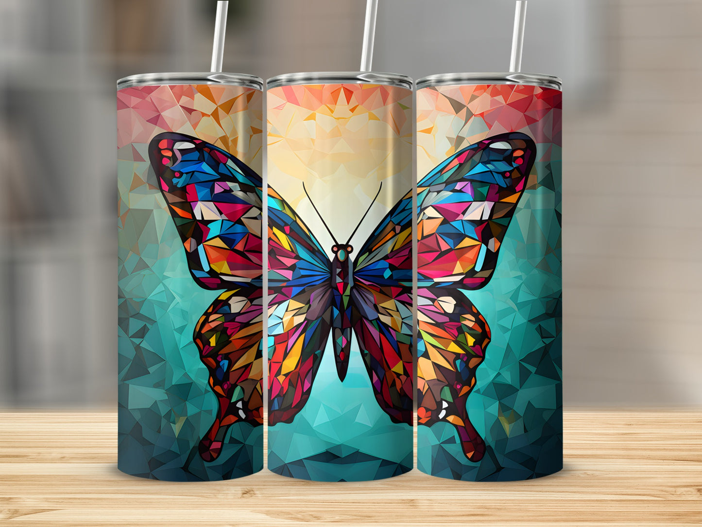 Three tumblers featuring a colorful, geometric butterfly design on a textured background.