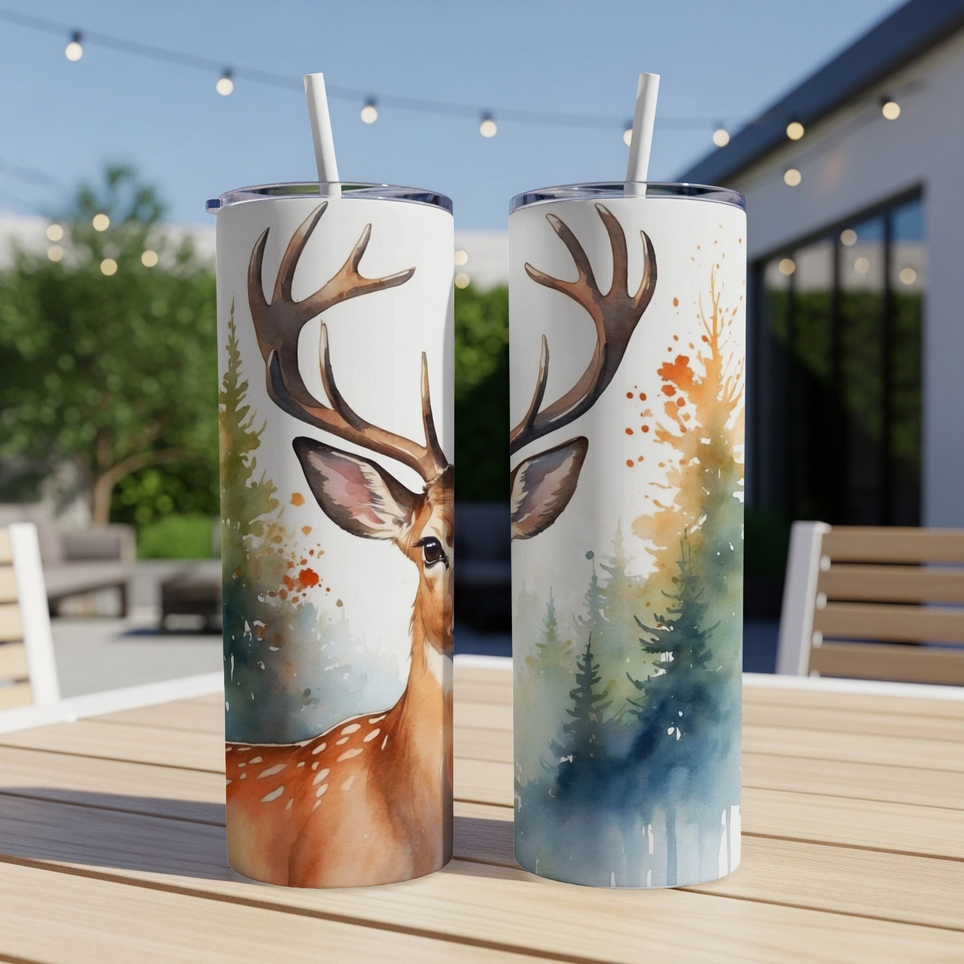 Two tumblers with deer and forest watercolor art, one showing a deer's face.