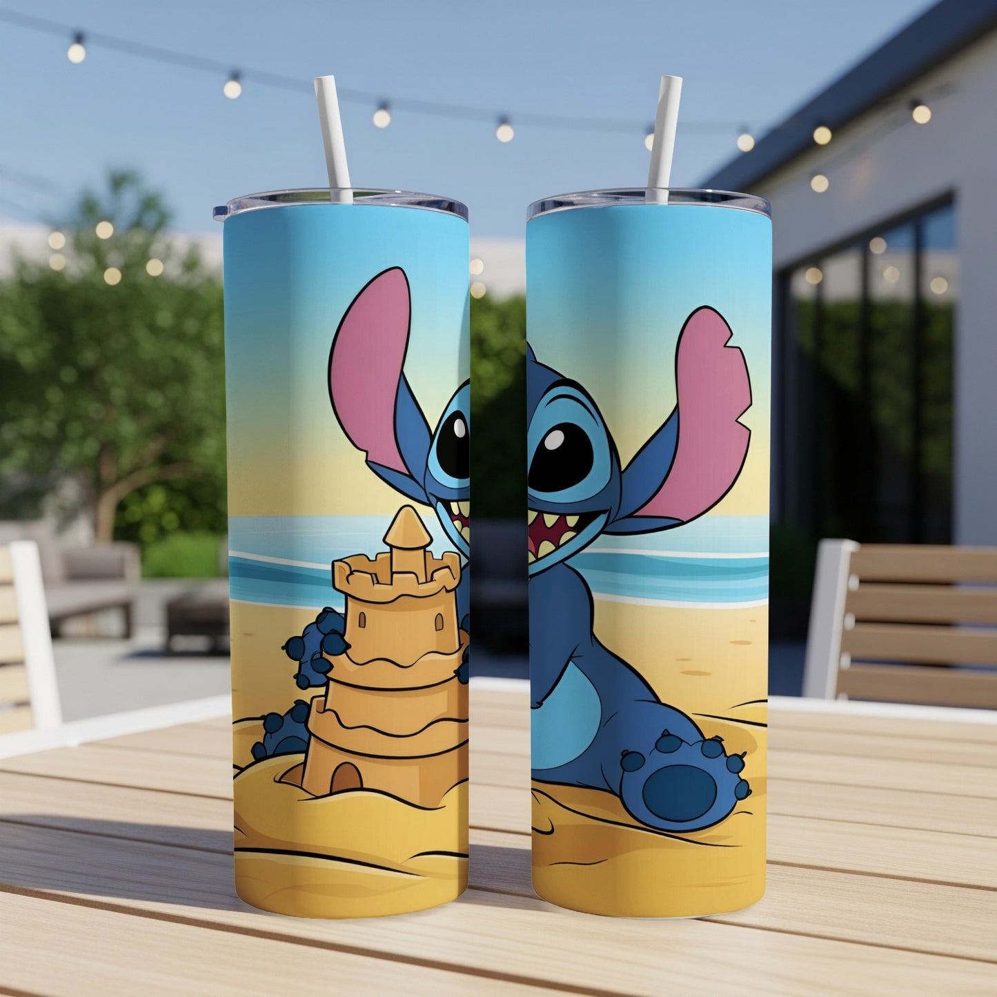 Blue Stitch character in sandcastle on a beach printed on a two-sided tumbler.