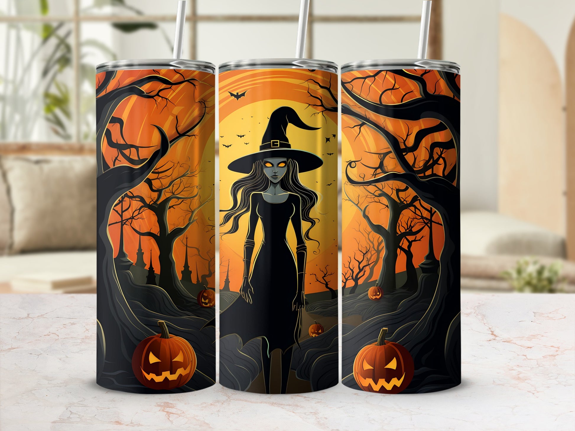 Three tumblers featuring a Halloween witch, pumpkins, and spooky trees.