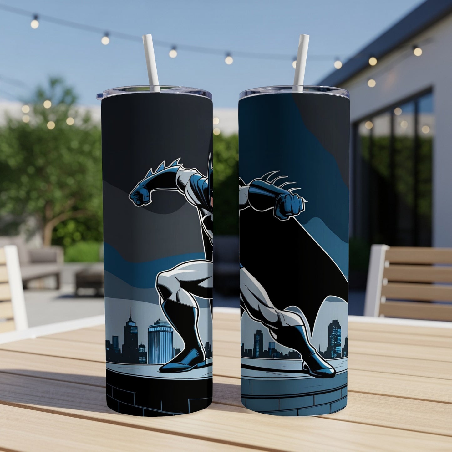 Two tumblers featuring Batman on a cityscape, with a straw in each.