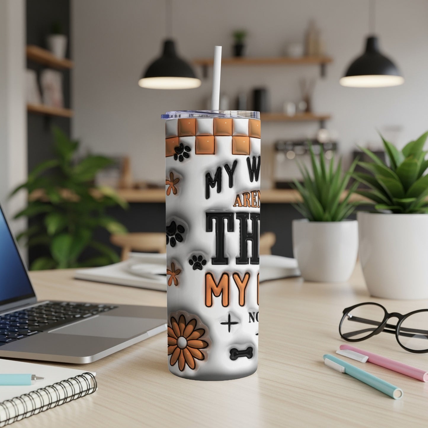White tumbler with dog paw prints and flowers, text "MY WORLD AREN'T..."