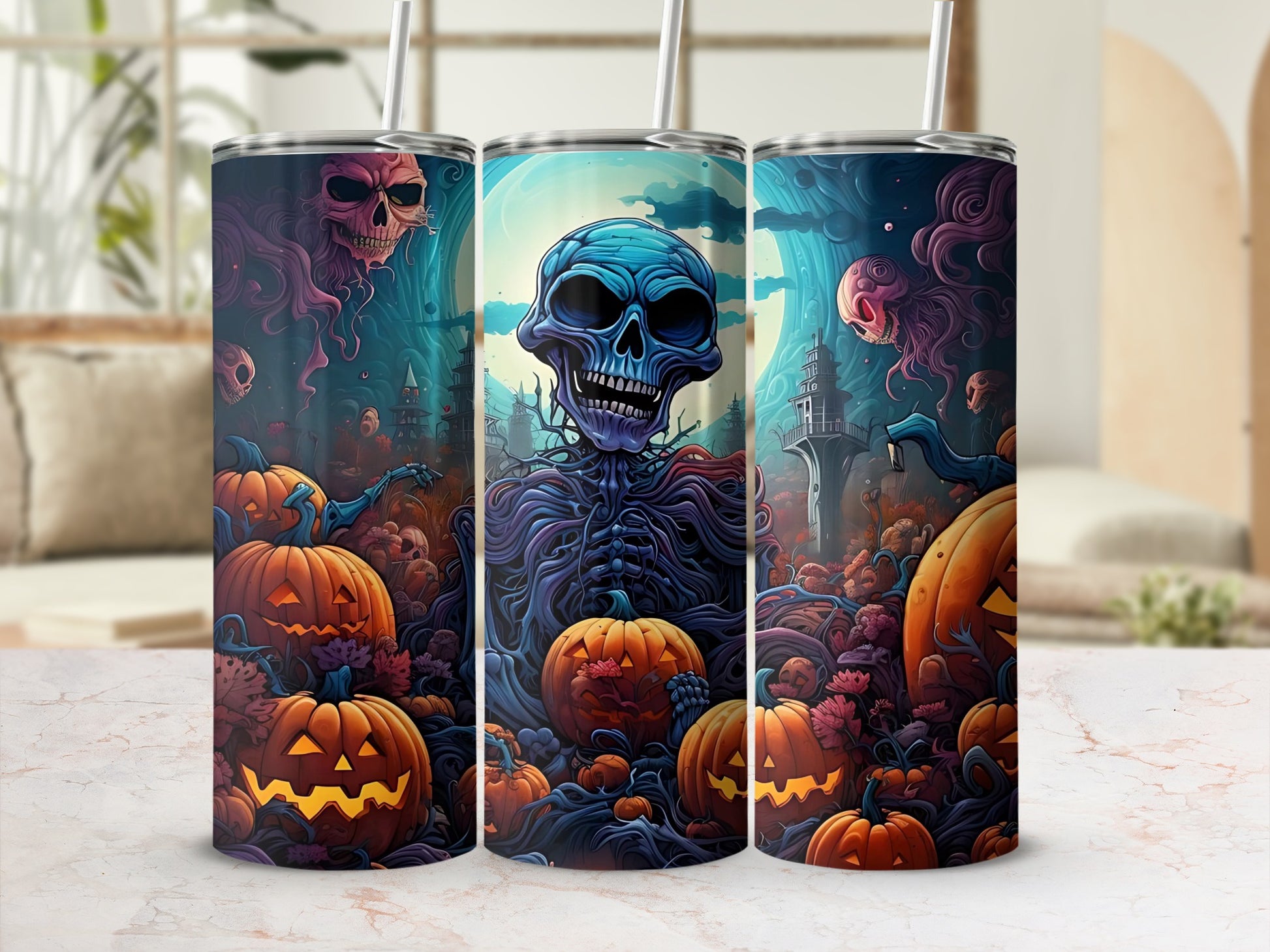 Three tumblers with Halloween skeletons, pumpkins, and spooky castle scenes.