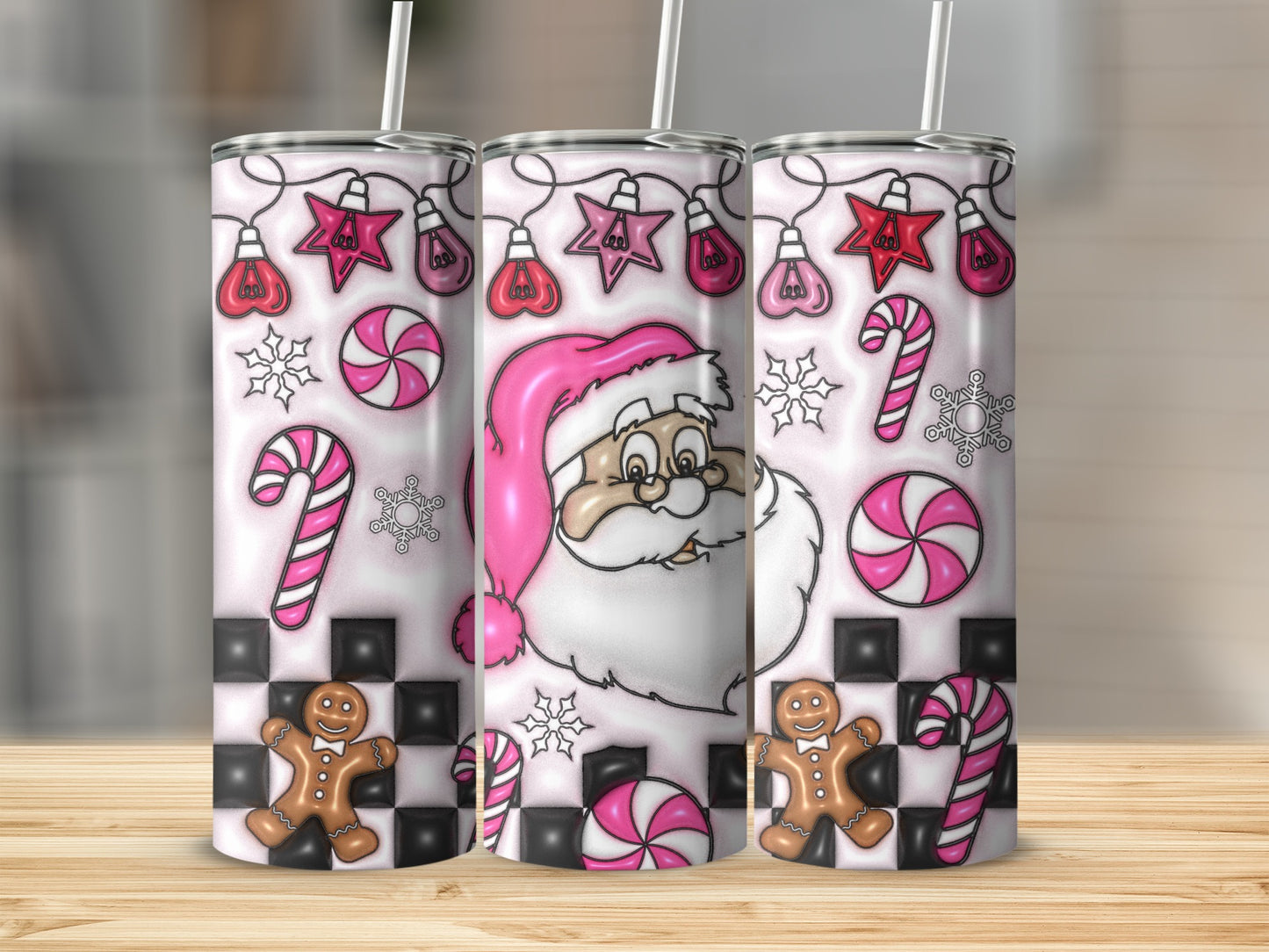 Three Christmas-themed tumblers with Santa, candy canes, gingerbread, and lights.