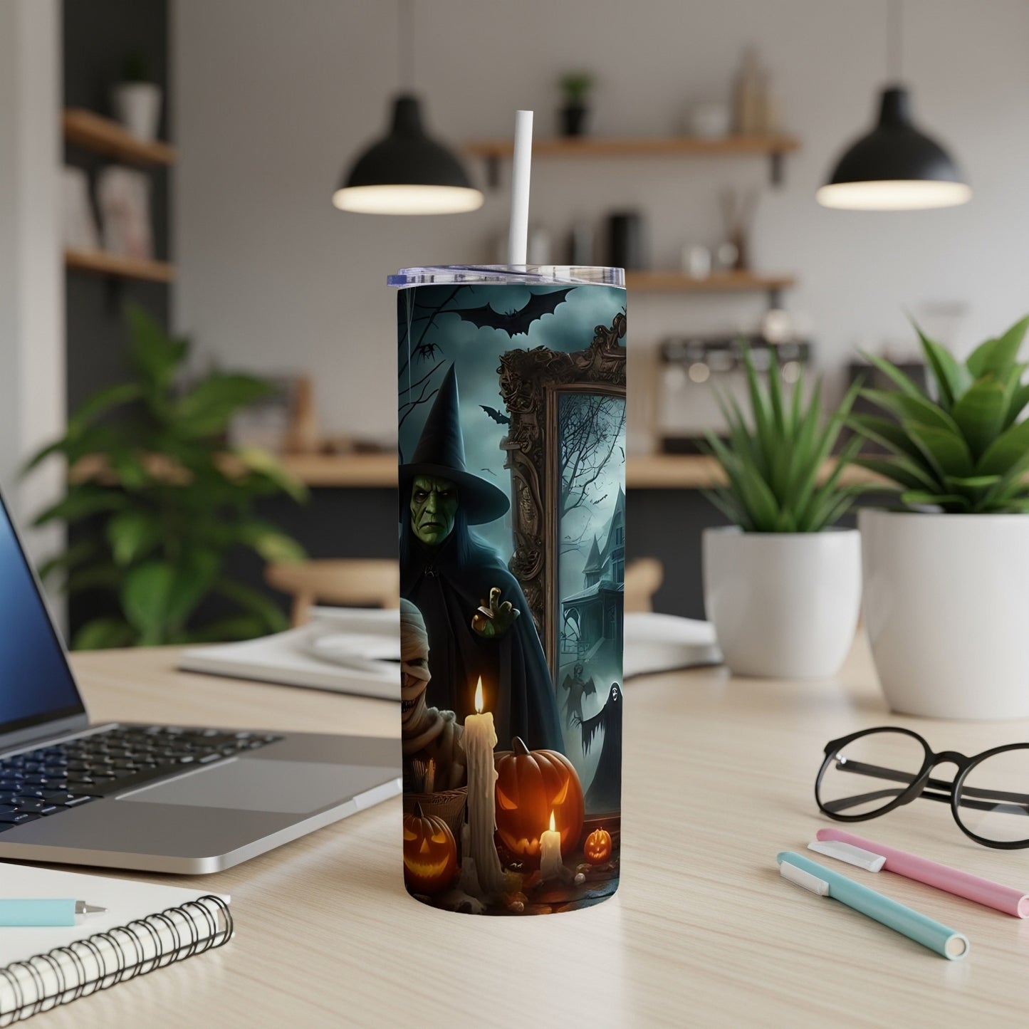 Halloween tumbler with witch, mummy, pumpkins, ghosts, and bats.