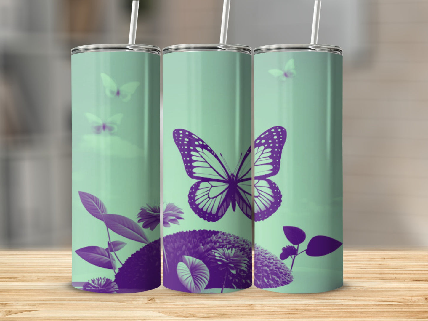 Three mint green tumblers with purple butterfly and floral designs.
