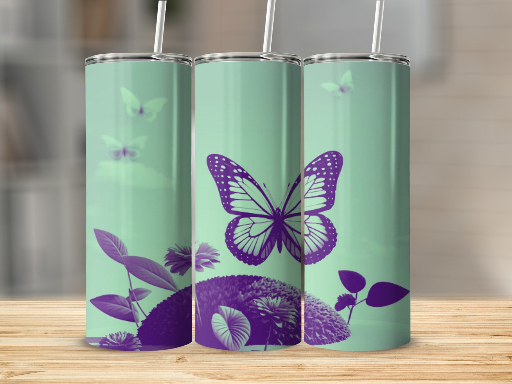 Three mint green tumblers with purple butterfly and floral designs.