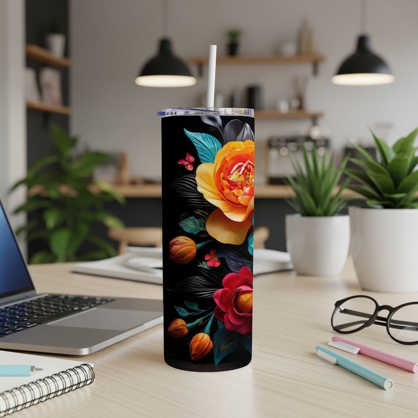 Black tumbler with vibrant orange and red floral design.