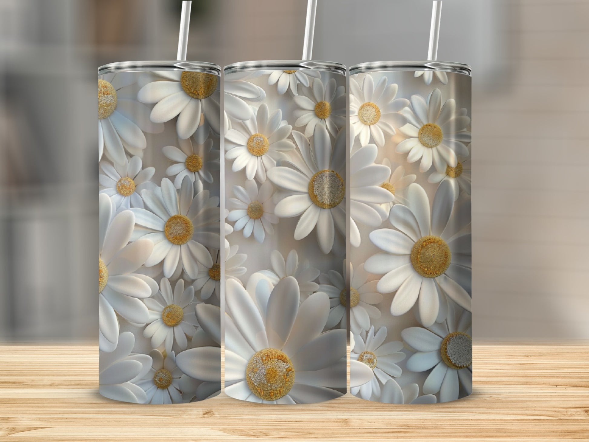 Three tumblers with a white daisy floral pattern.