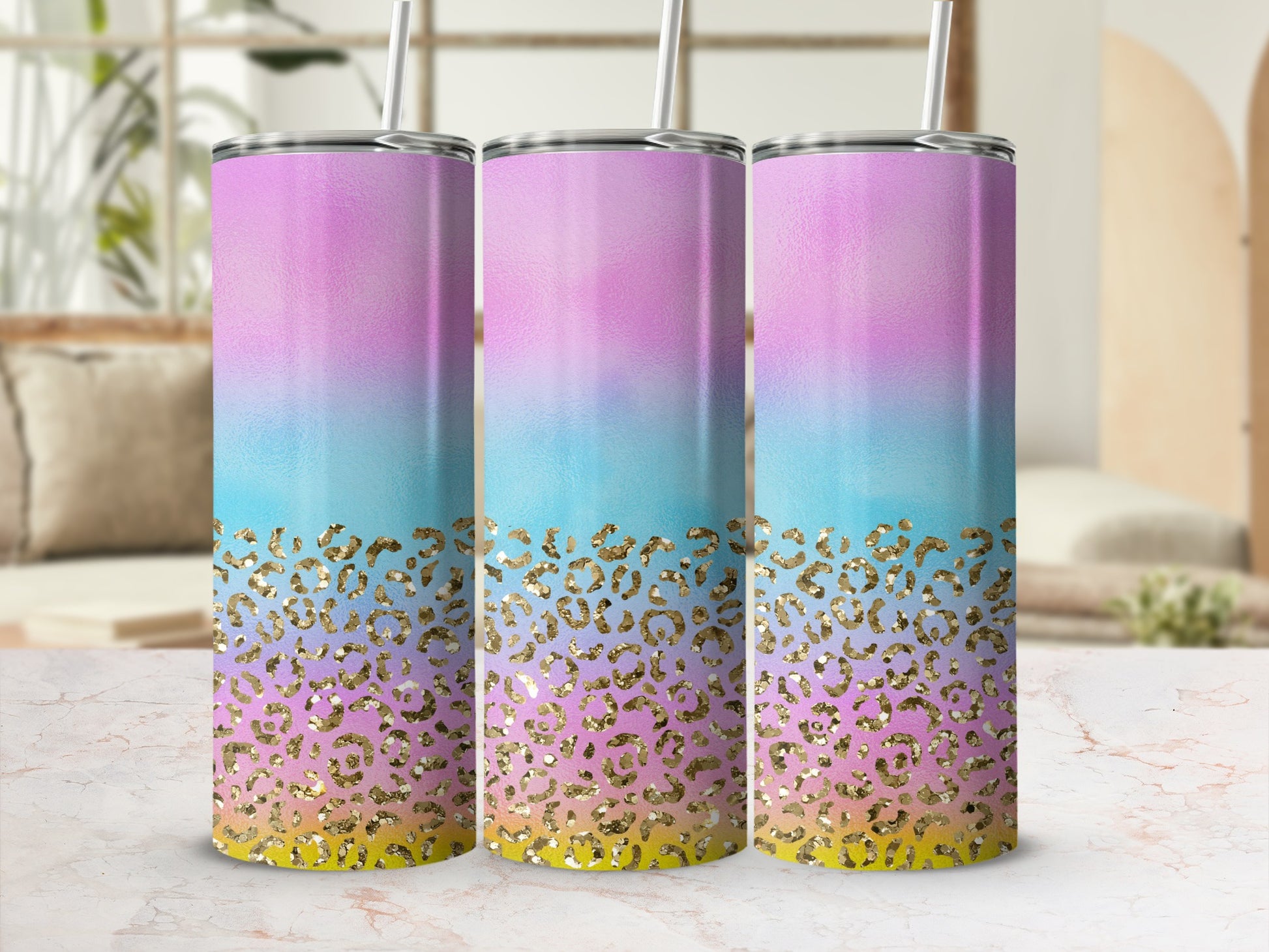 Three tumblers with pastel ombre and gold leopard print designs.