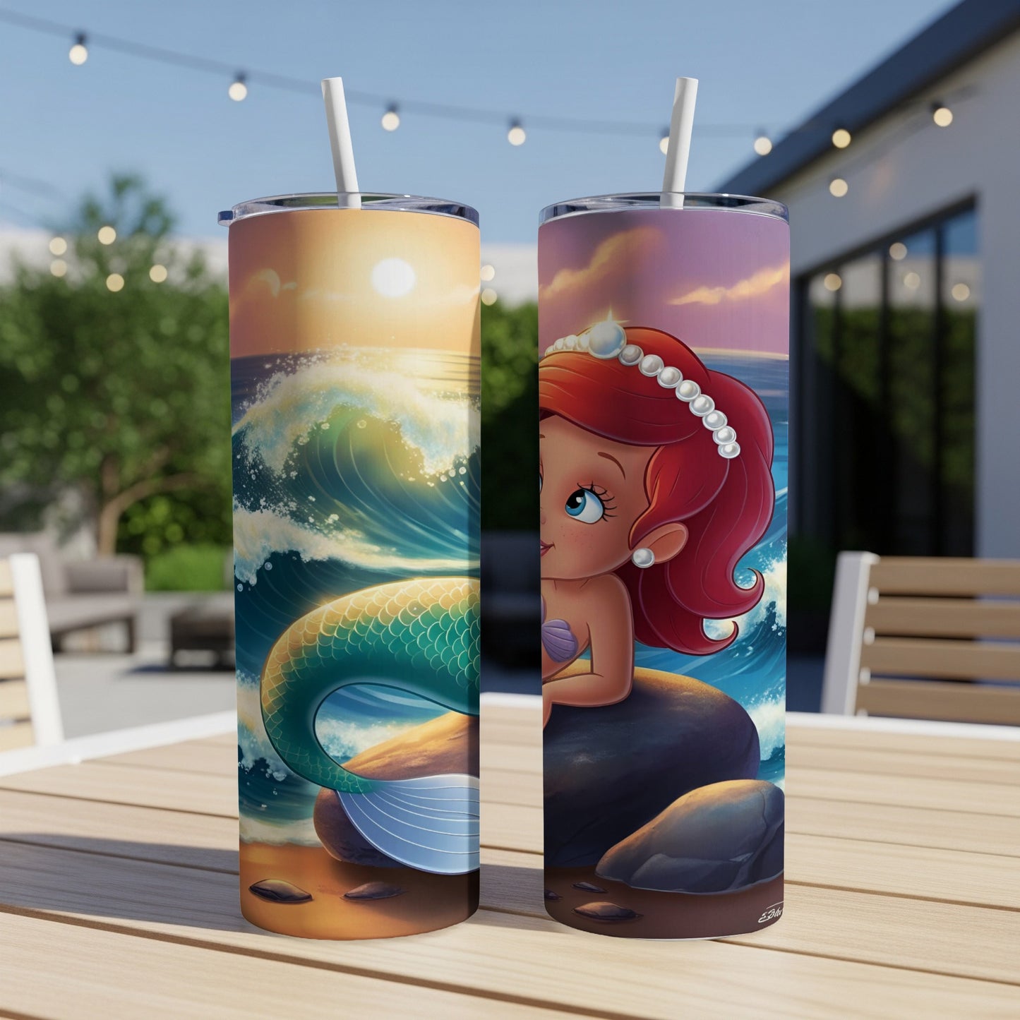 Two tumblers with The Little Mermaid characters on a table.