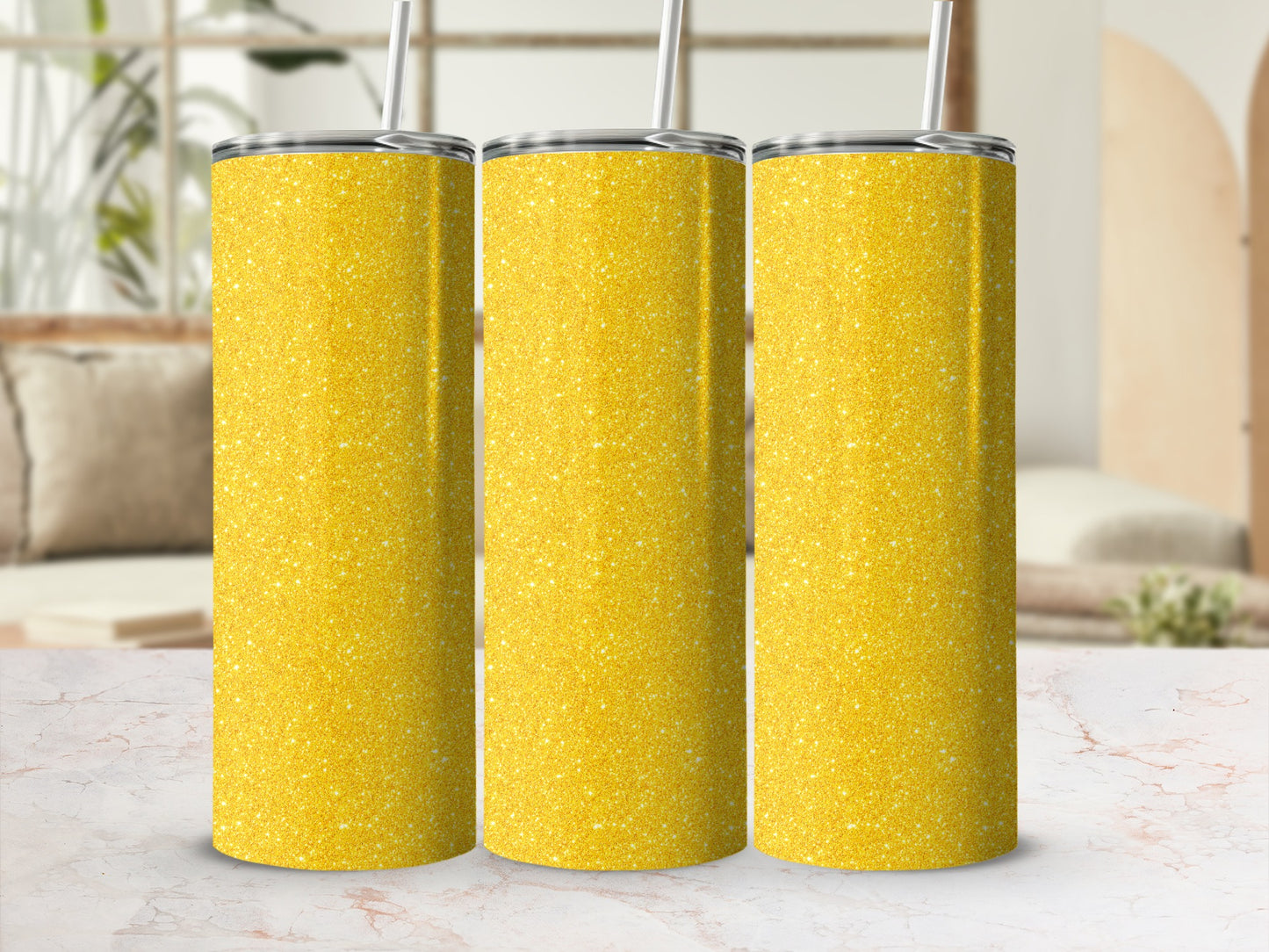 Three yellow glitter tumblers with straws displayed side-by-side.