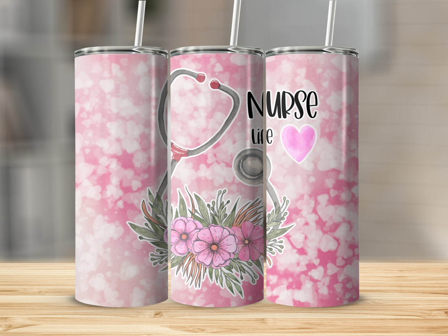 Nurse Life tumbler with stethoscope and pink flowers on a pink bokeh background.