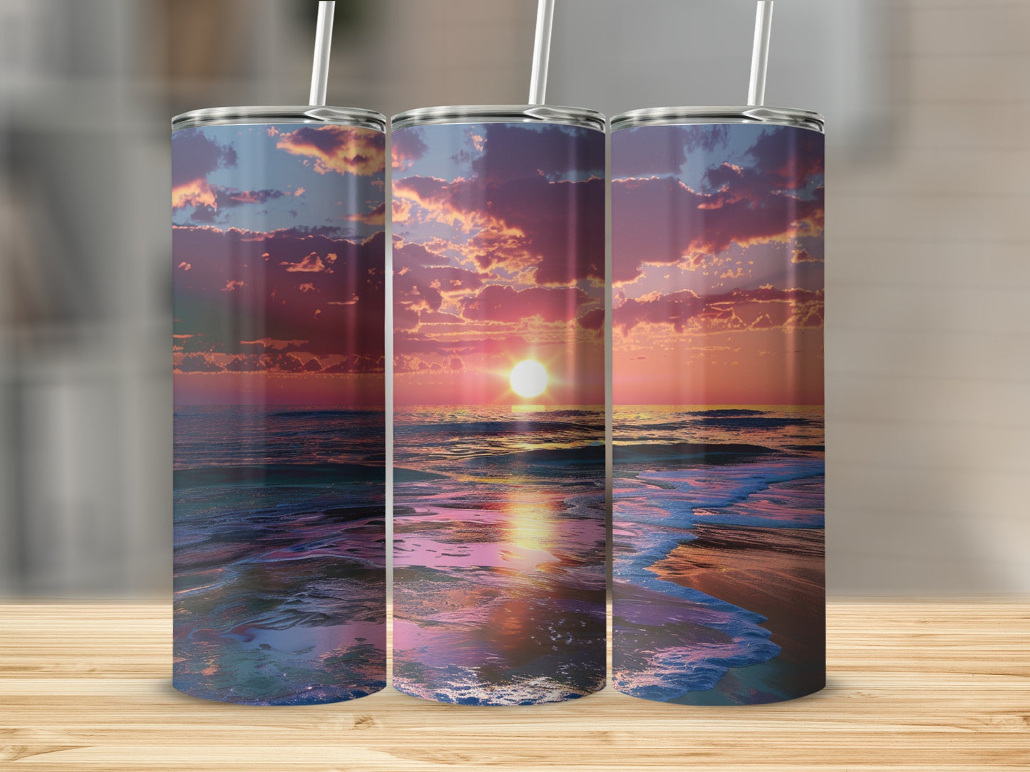 Three tumblers with a sunset ocean waves scene.
