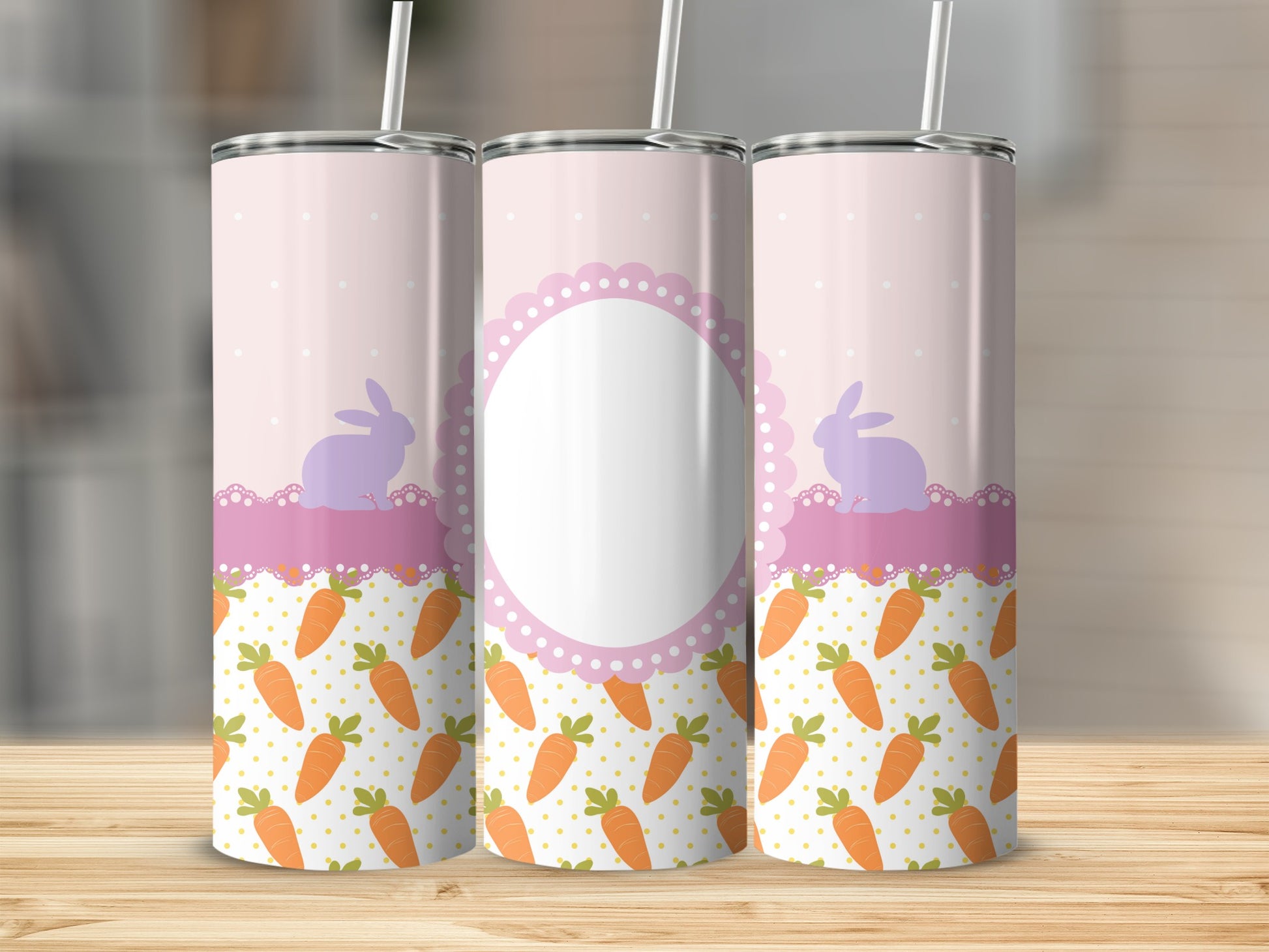 Pink tumbler with rabbits and carrots, blank oval label in center.
