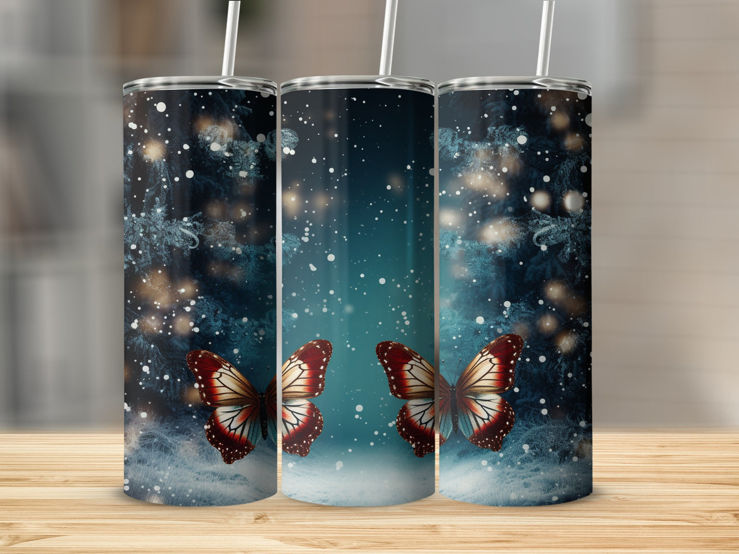 Three tumblers with iridescent butterflies and a snowy forest design.
