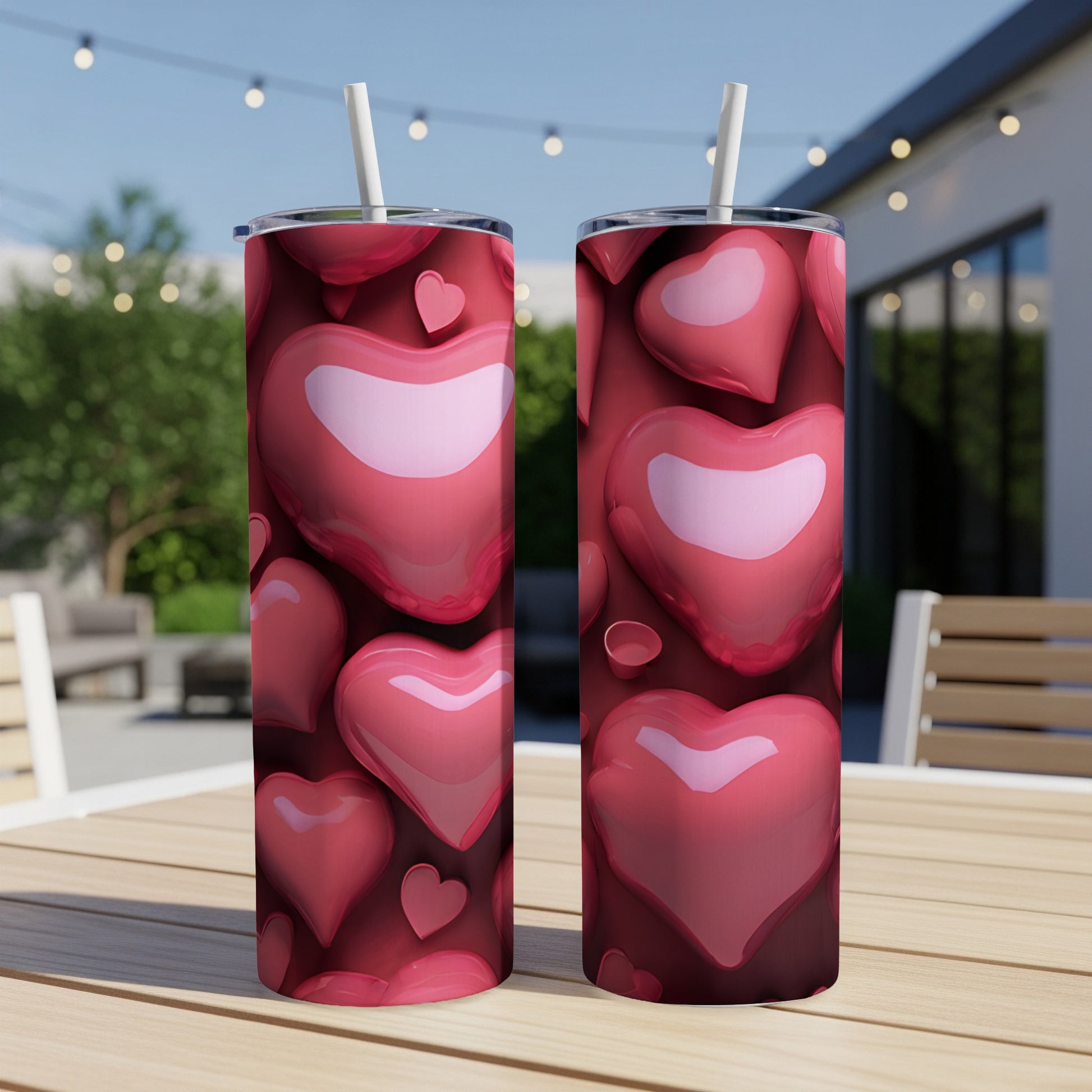 Two tumblers with a repeating pattern of glossy red hearts.
