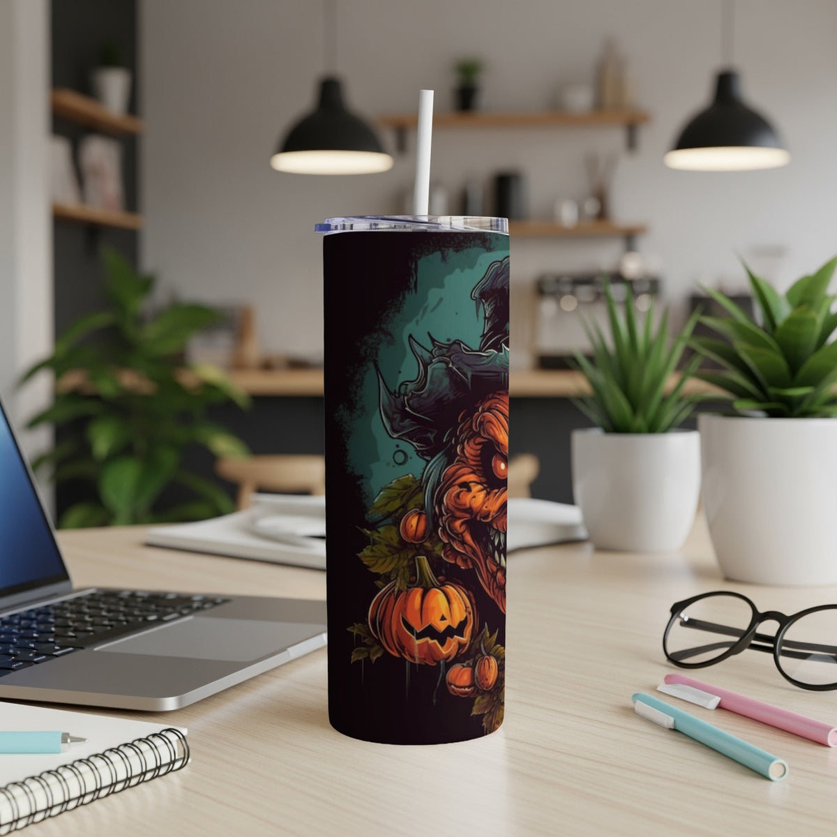 Black tumbler with a spooky Halloween design featuring a pumpkin and monster.