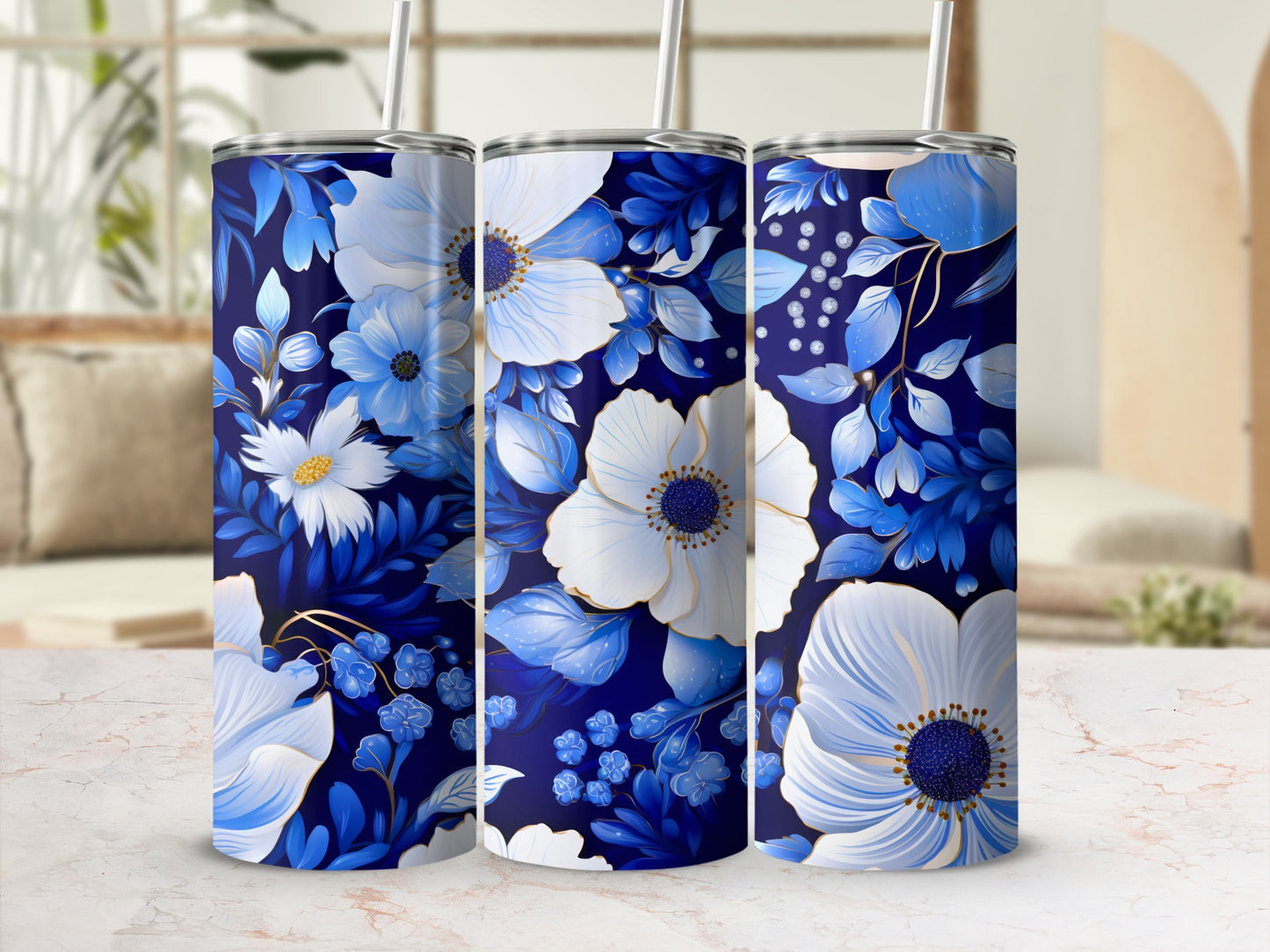 Three tumblers with white and blue floral pattern on navy background.