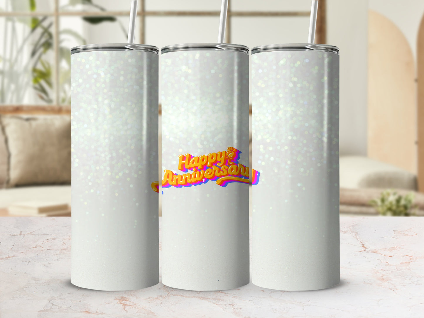Three white tumblers with "Happy Anniversary" text on the middle one.