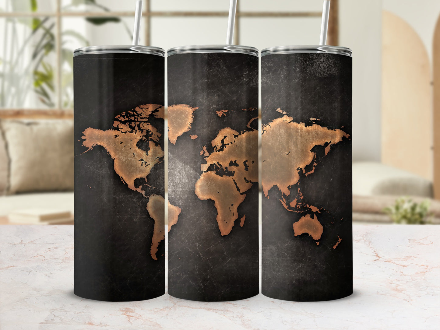 Three stainless steel tumblers featuring a distressed copper world map design.