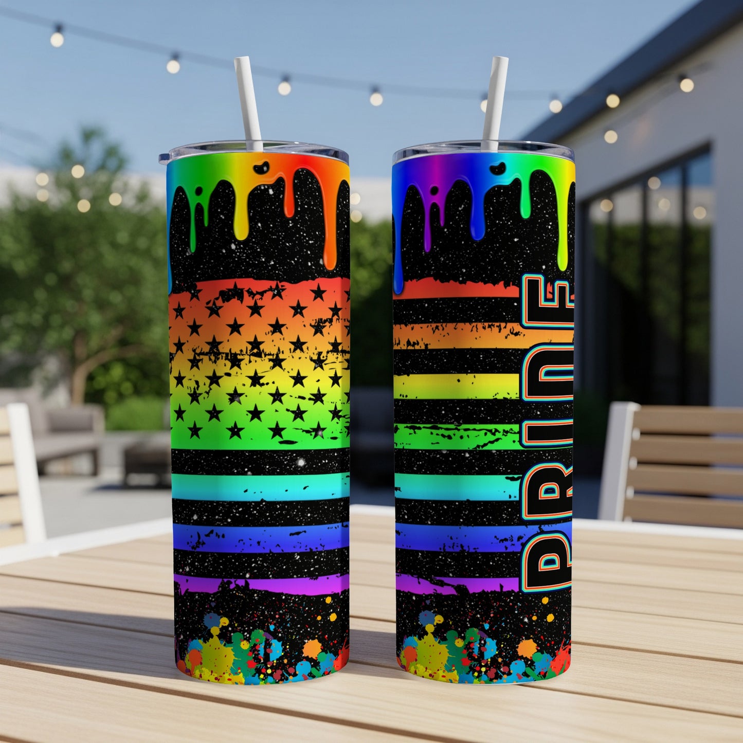 Two tumblers with pride flag design and black splattered paint.