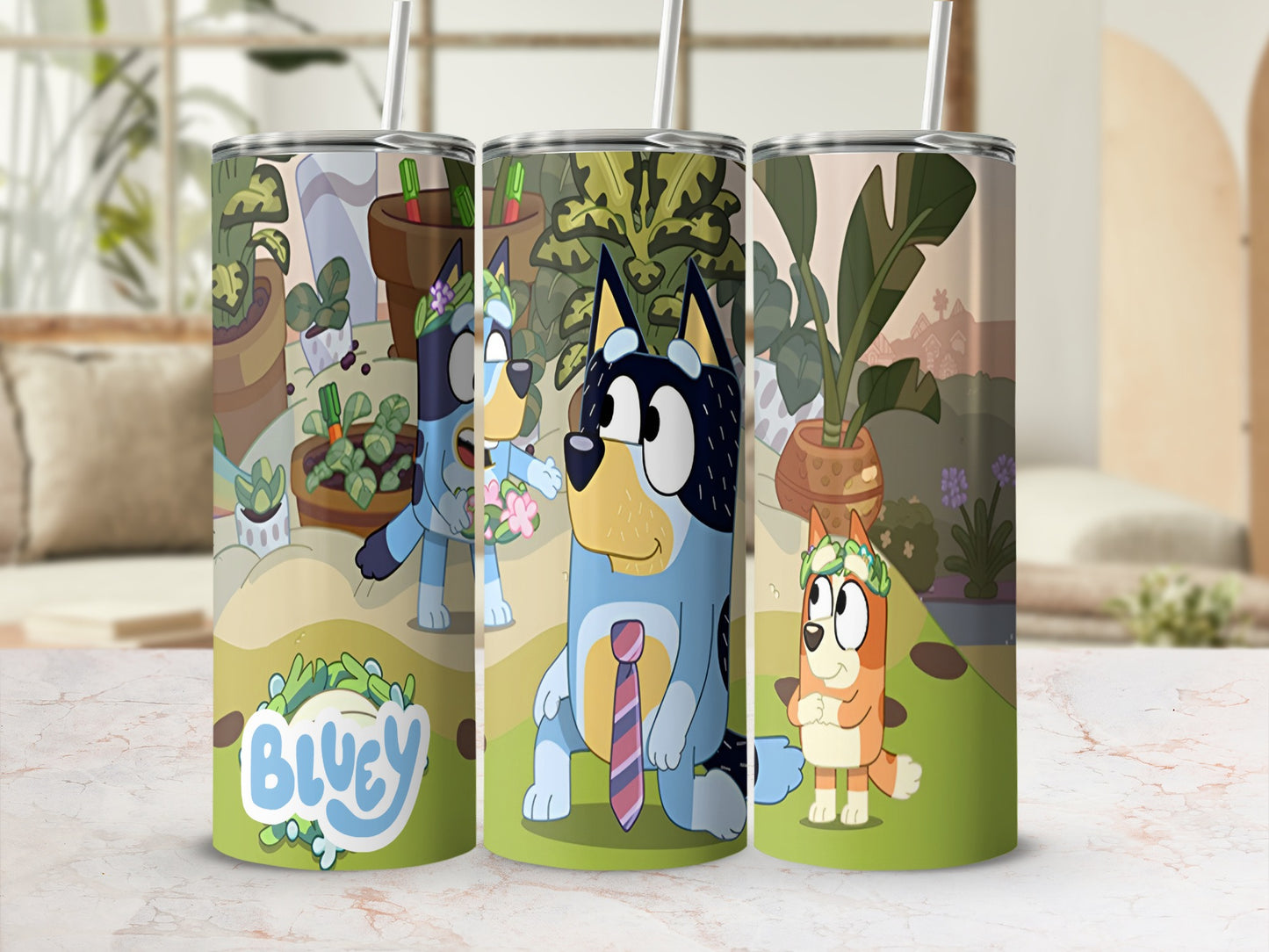 Bluey and Bingo characters on a patterned tumbler with plants and a "Bluey" logo.
