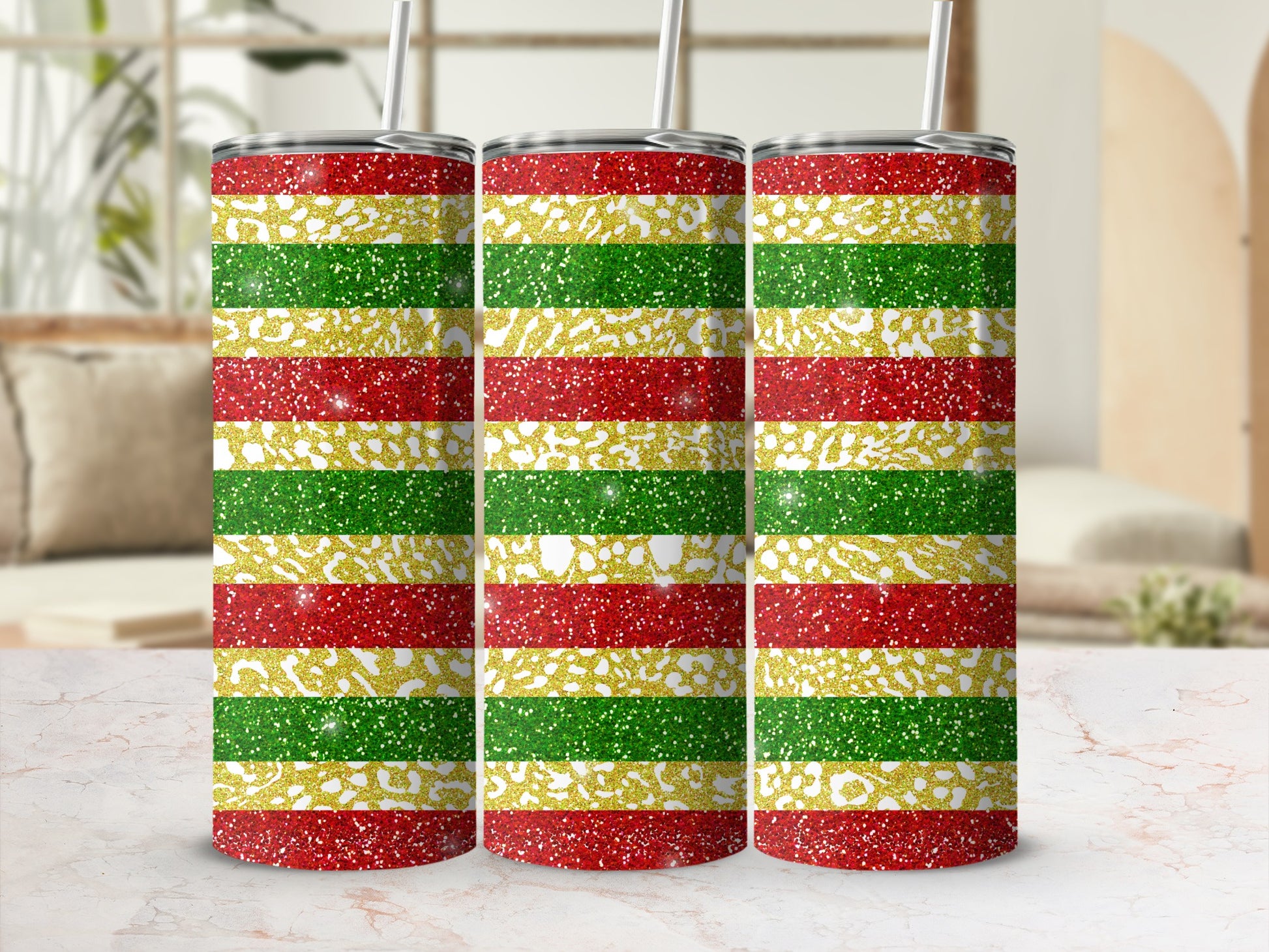 Glittering horizontal stripes in red, gold, and green on a set of three tumblers.