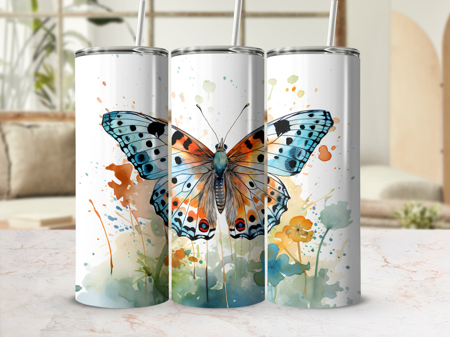 Three tumblers with watercolor butterfly and floral designs.