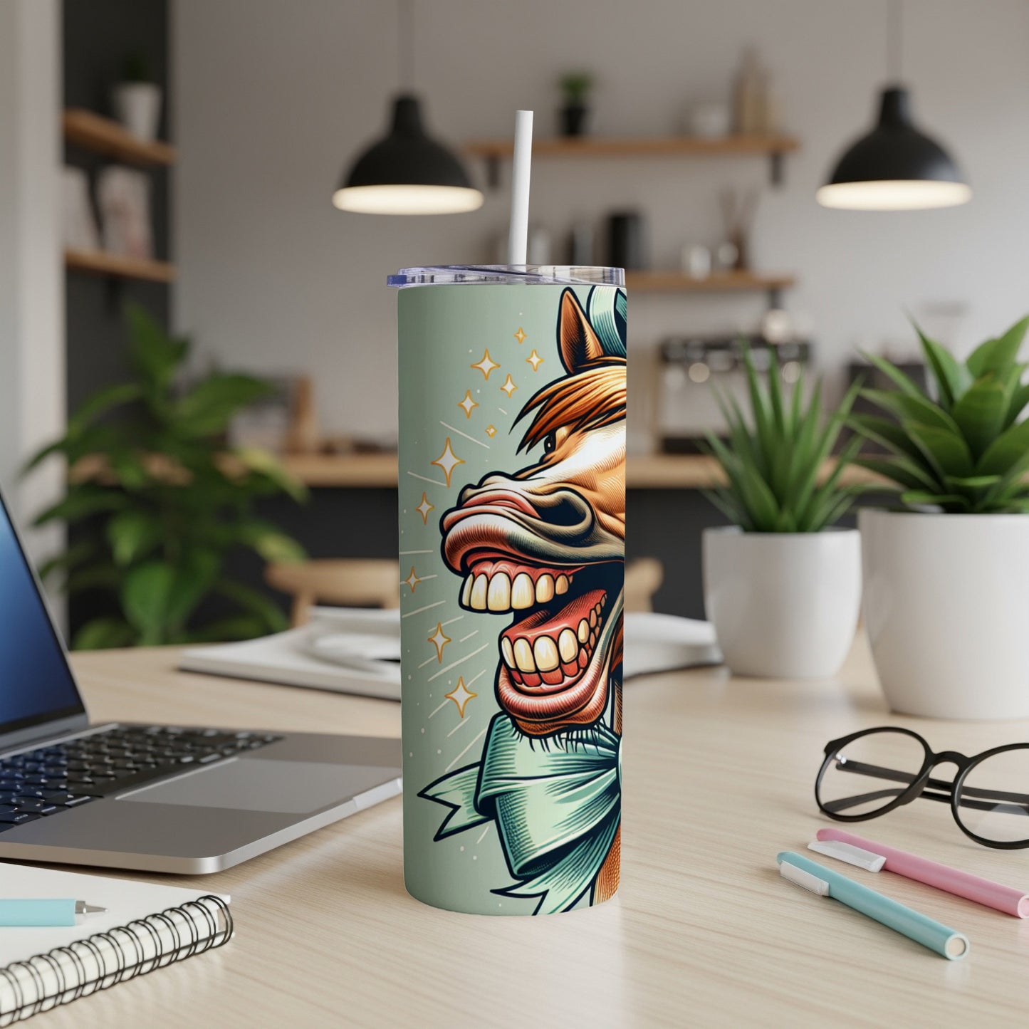 Mint green tumbler with a cartoon horse's head and bow.